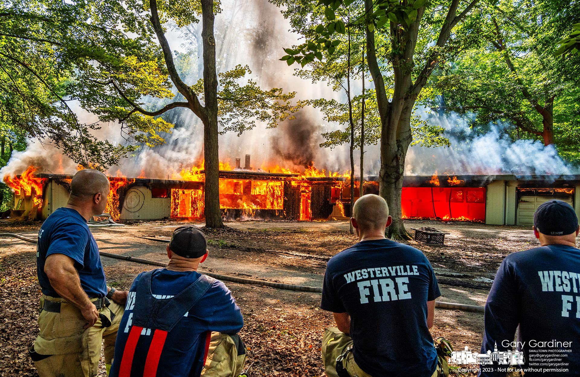 Westerville firefighters watch a controlled burn after training in a home to be demolished was donated to the department for training. My Final Photo for September 19, 2023. https://bit.ly/3t7KYiP