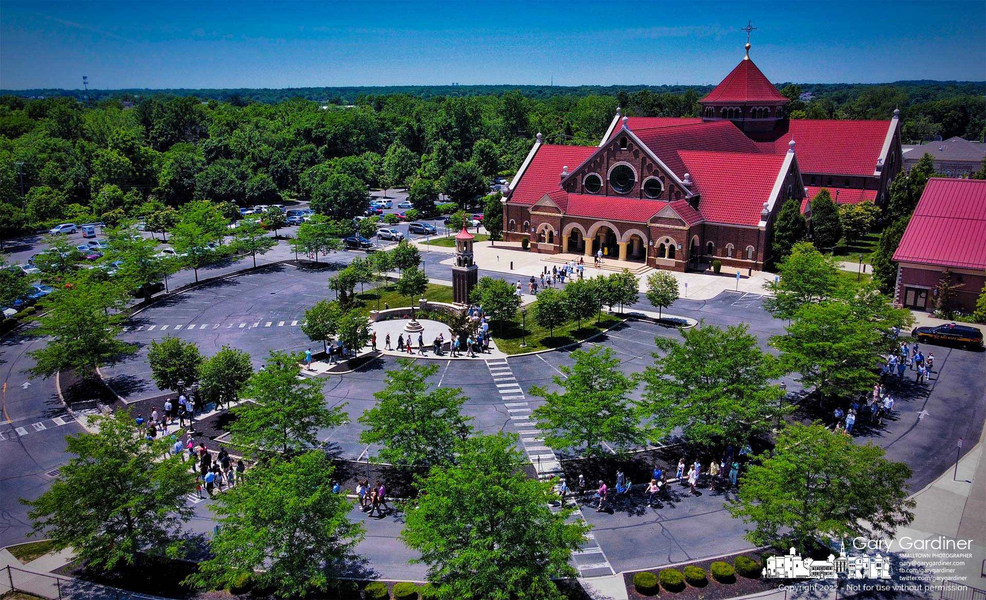 Rev. Jonathan Wilson leads parishioners back into St. Paul the Apostle Catholic Church following a Eucharistic procession around the church at the end of Mass on Corpus Christ Sunday. My Final Photo for June 19, 2022.