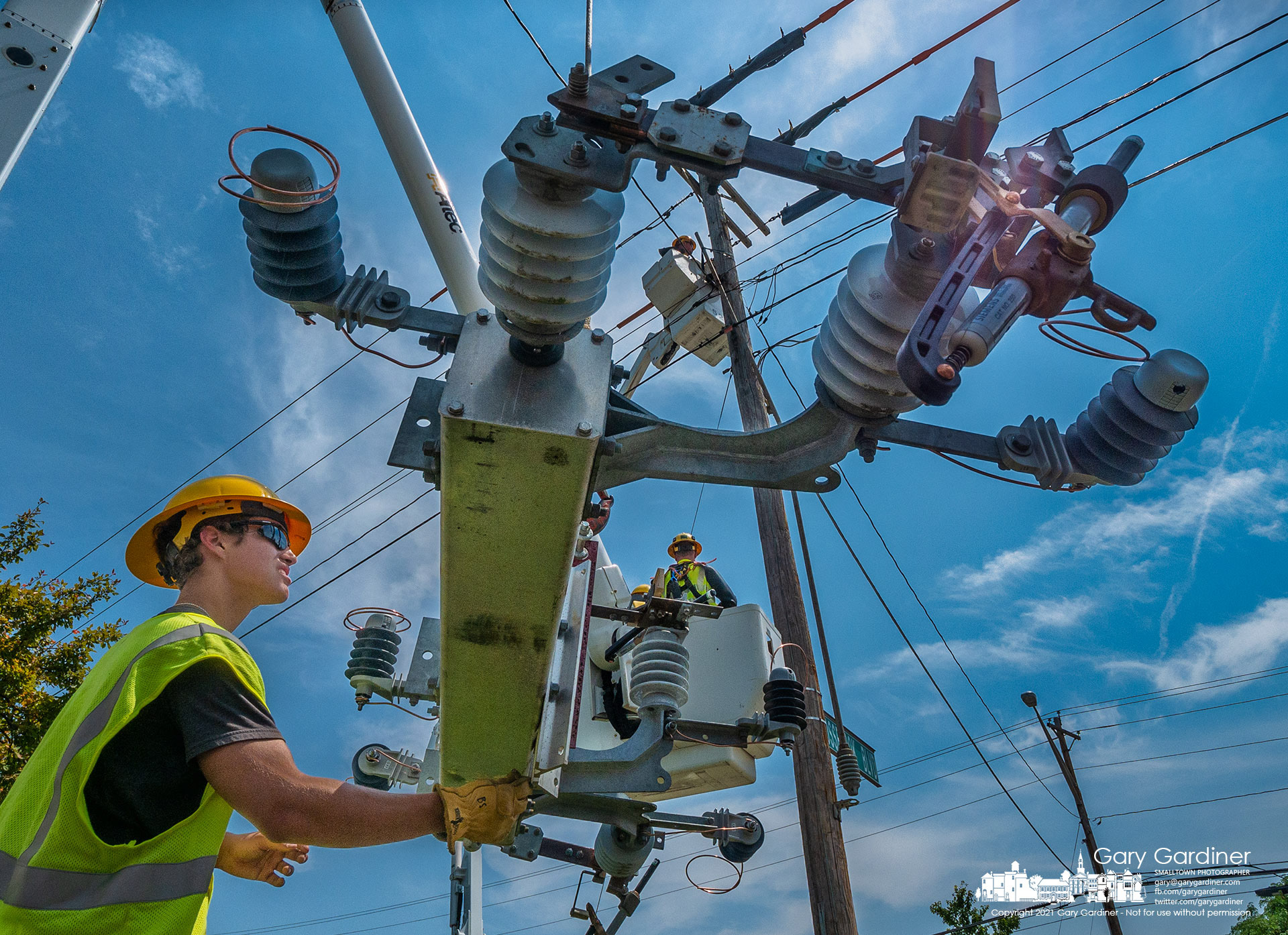 A city electric crew replaces a worn and damaged switch on a utility pole on Schrock Road. My Final Photo for July 22, 2021.