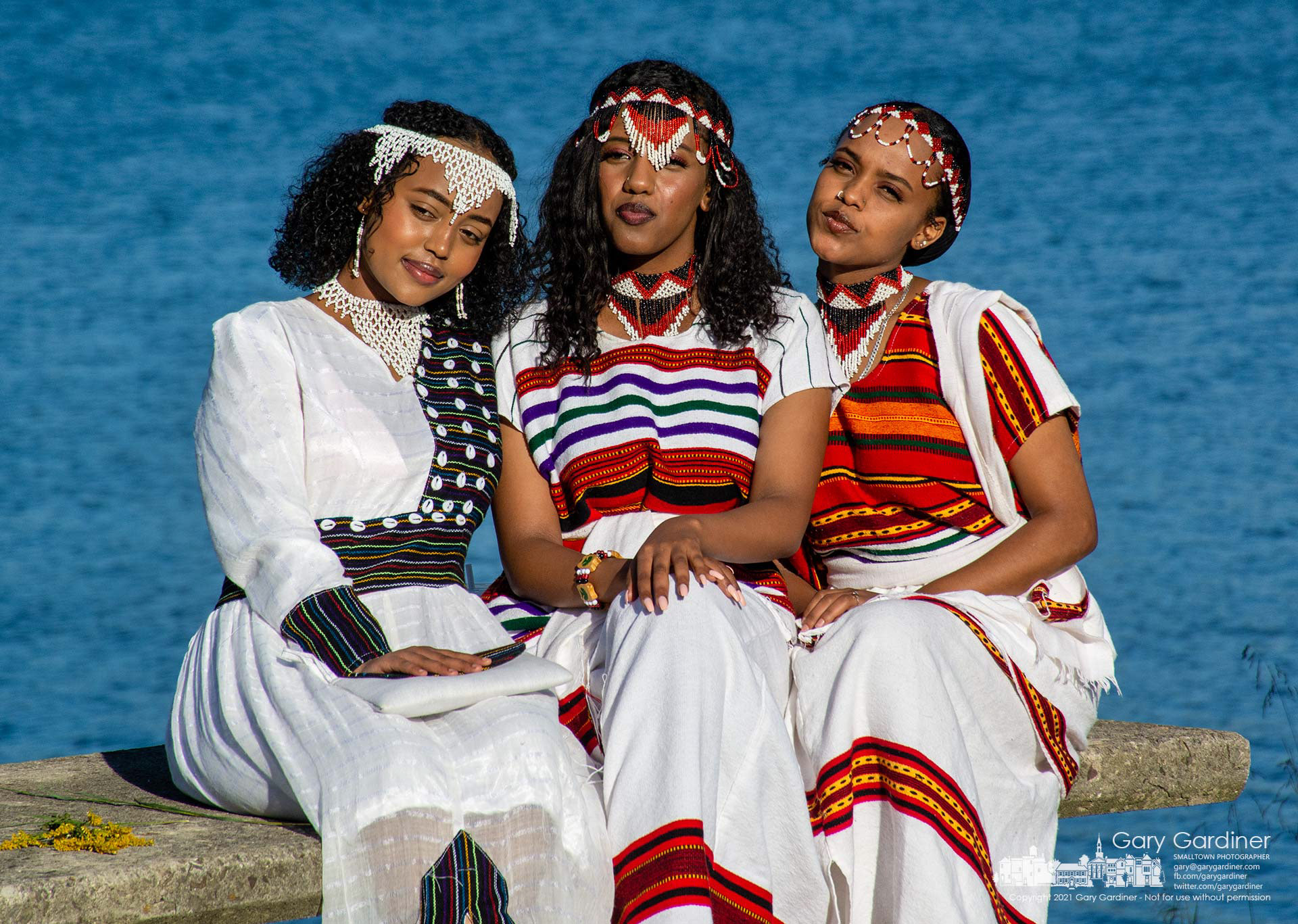 Three Oromia women wearing chelie beadwork pose for a photo with their family during the group's celebration of Irreecha, a tradition marking the end of the rainy season for the regional state in Ethiopia. My Final Photo for Sept. 26, 2021.