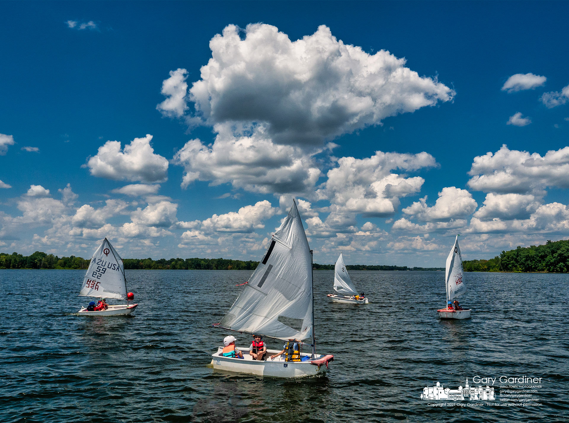 Novice sailors navigate their way around a set of buoys marking a shorter course for their smaller boats during lessons at Hoover Sail Club Tuesday. My Final Photo for Aug. 3, 2021.