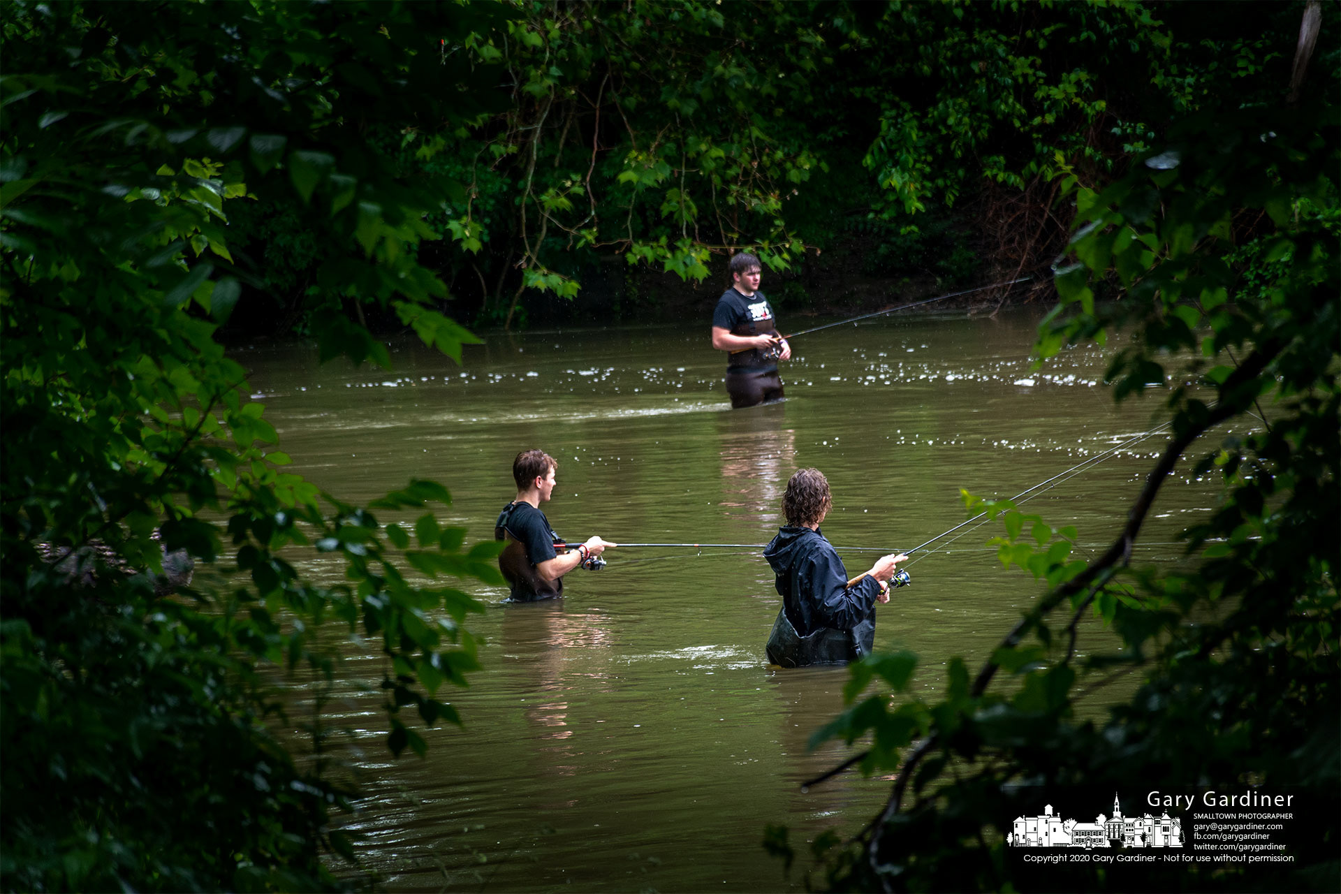 A trio of fishermen try their luck at fishing and navigating the higher than normal rushing waters below the dam at Alum Creek Park in Westerville. My Final Photo for June 9, 2021.