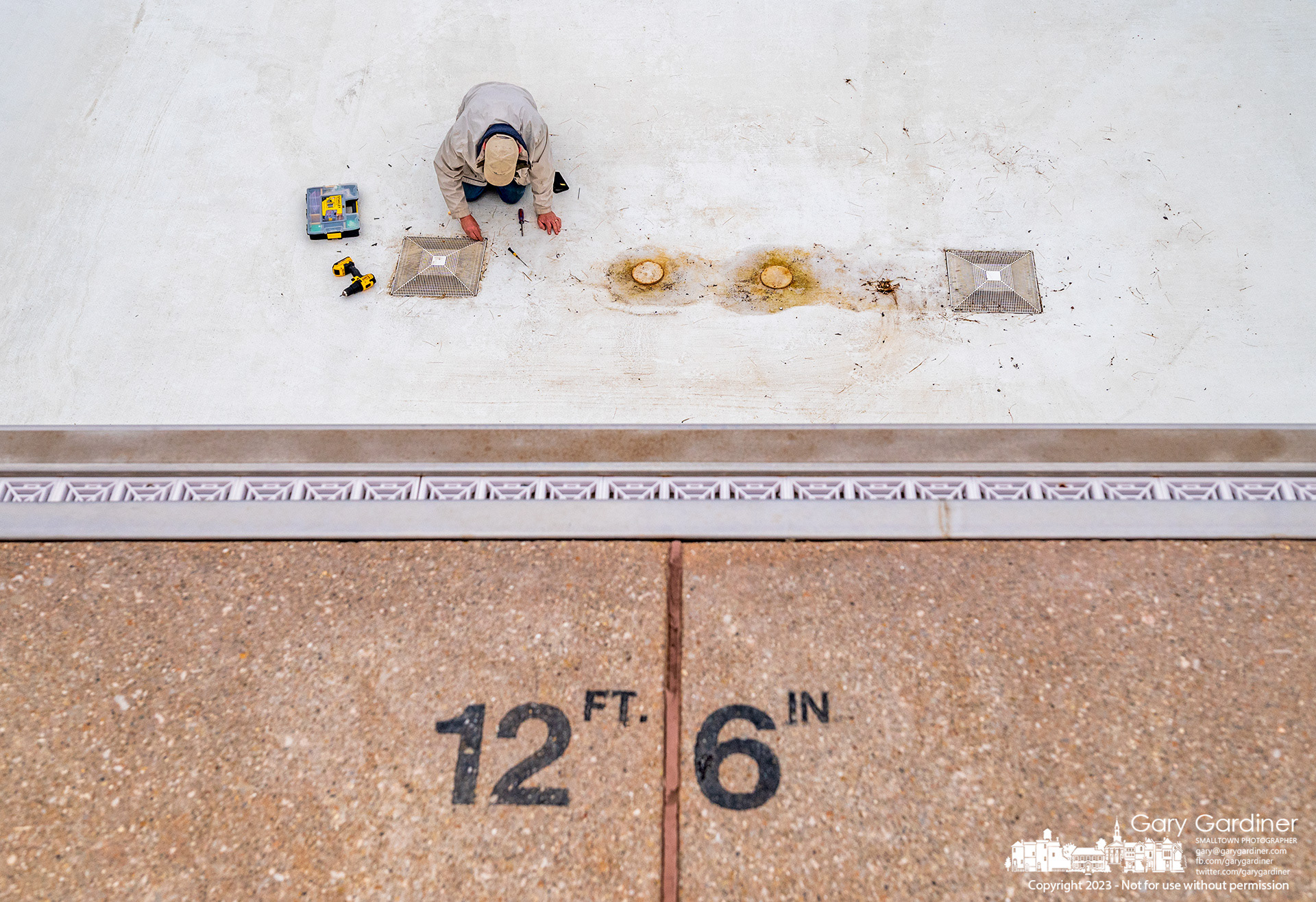 The drains in the diving and lap pool at Highlands Aquatic Park get a final check before it becomes the first pool filled for the summer as the center is prepared for opening on May 27. My Final Photo for April 27, 2023.