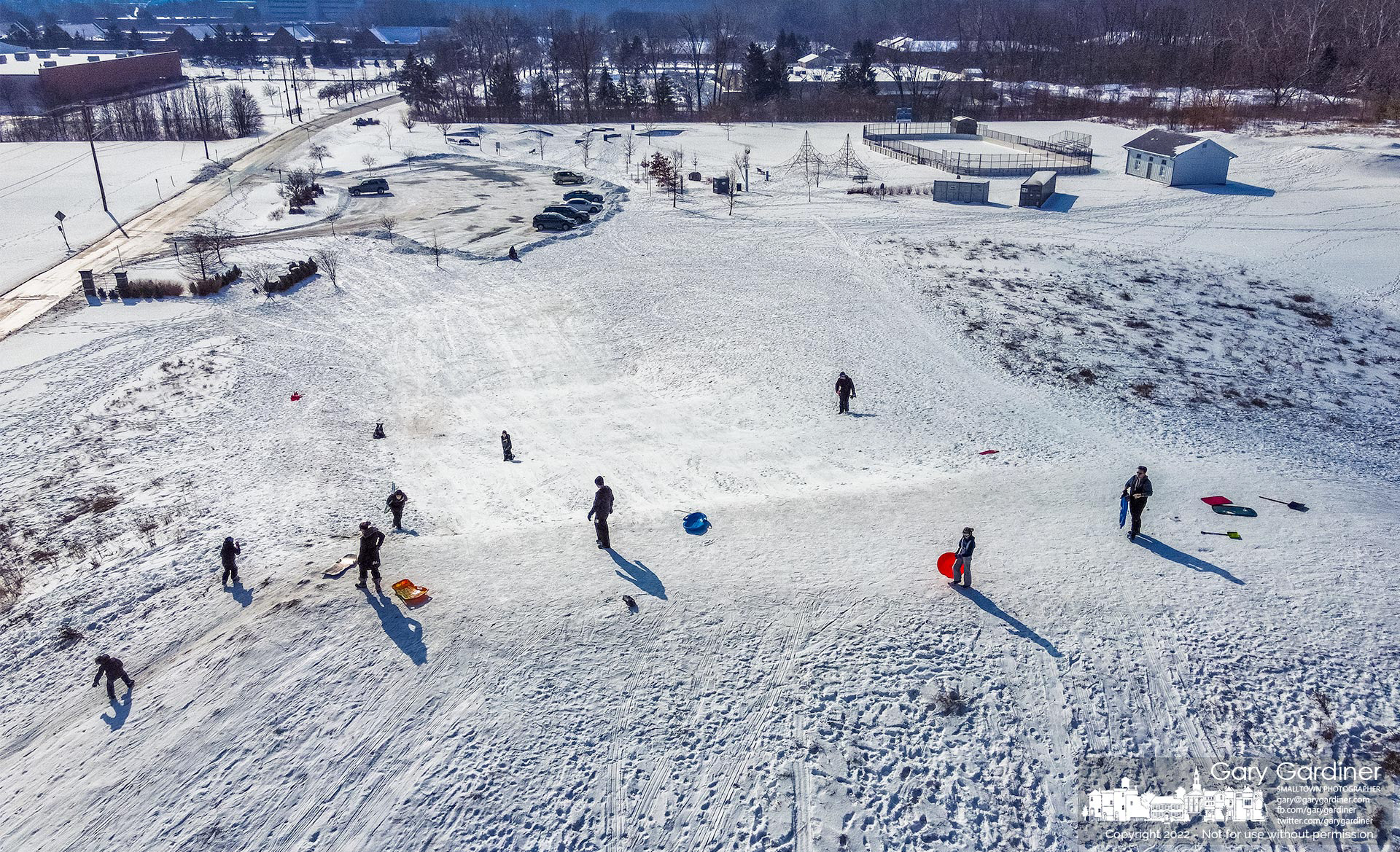 Sledders spread themselves across the top of the sledding hill at Alum Creek Park South to take advantage of a small amount of snow that fell overnight on a thick layer of ice and compacted snow from an earlier storm. My Final Photo for Feb. 5, 2021.