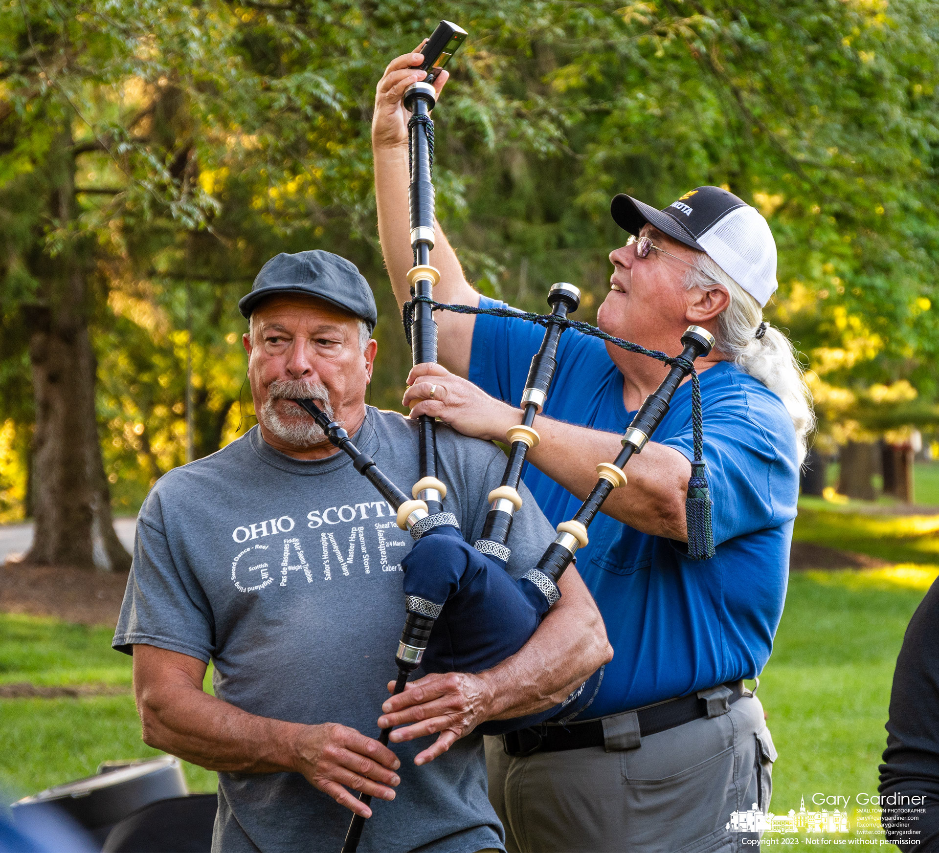 A bagpiper from the Capital City Pipes and Drums Corp gets his instrument tuned during rehearsal at Alum Creek Park North for an upcoming competition and performing during the Andre Rieu concert at the Schottenstein Center. My Final Photo for August 29, 2023. https://bit.ly/3sxdHxl
