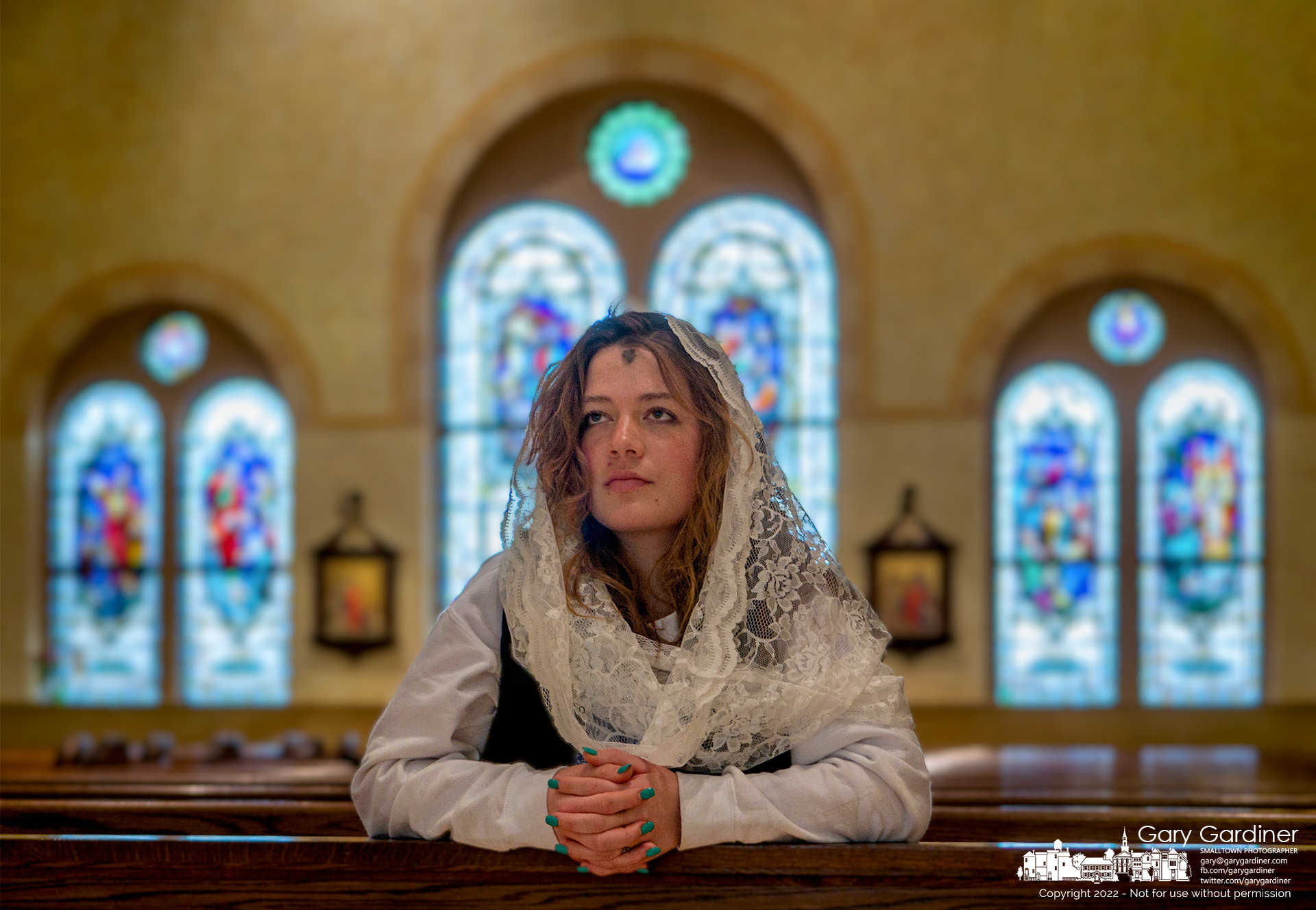 Ciara Garrity kneels after Ash Wednesday services at St. Paul the Apostle Catholic Church in Westerville. My Final Photo for March 2, 2022.