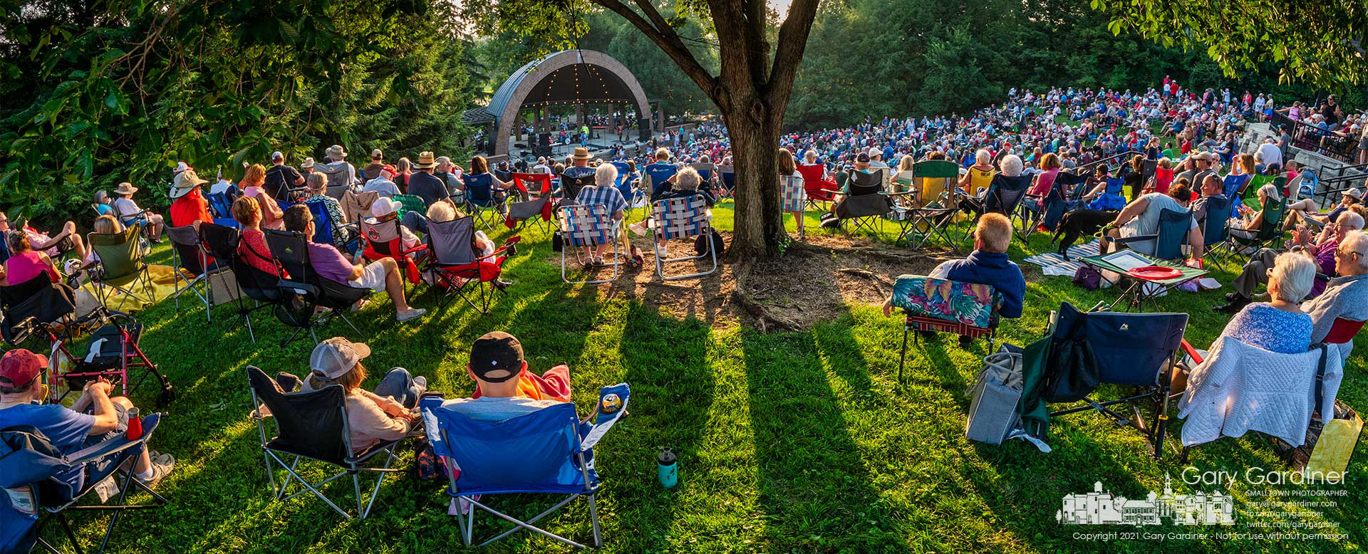 An overflow crowd gathers on the lawns at the Westerville Amphitheatre Sunday evening to hear “The British Invasion” as part of the Summer Concert Series that was canceled last year because of the pandemic. My Final Photo for August 1, 2021.