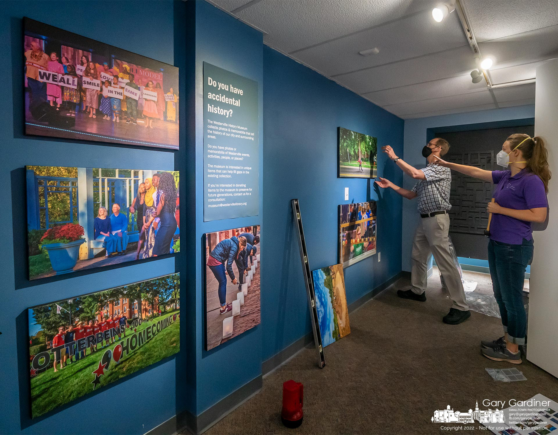 Staffers at the Westerville History Museum mount photographs from the "Accidental History" Traveling Exhibit, a collection of 75 photos chronicling a portion of the life of Westerville for 10 years. My Final Photo for July 27, 2022.