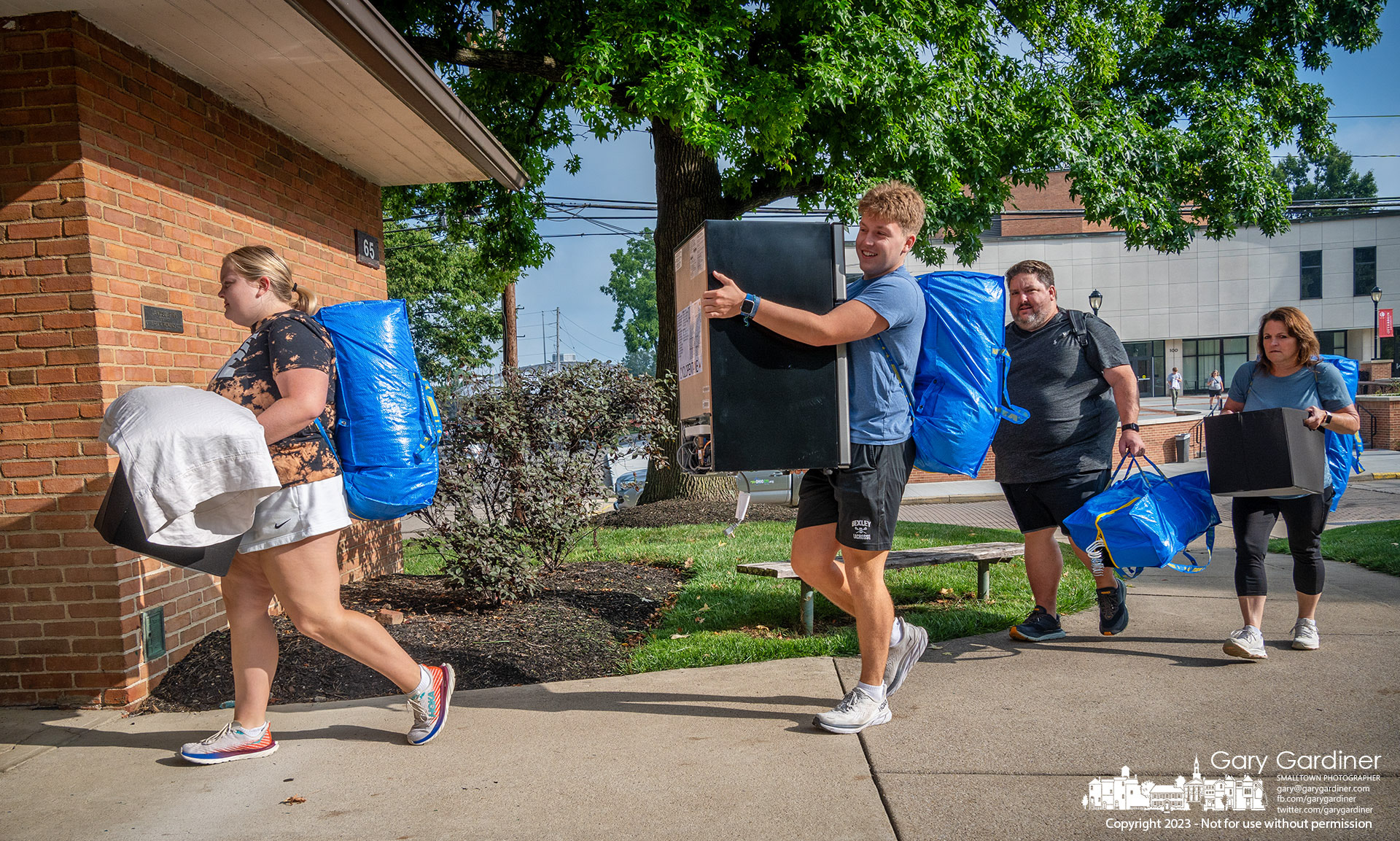 An Otterbein freshman carrying some of belongings is followed into Hannah Mayne dormitory by her family bearing the remainder of the necessities for her first year at the Westerville university. My Final Photo for August 16, 2023.