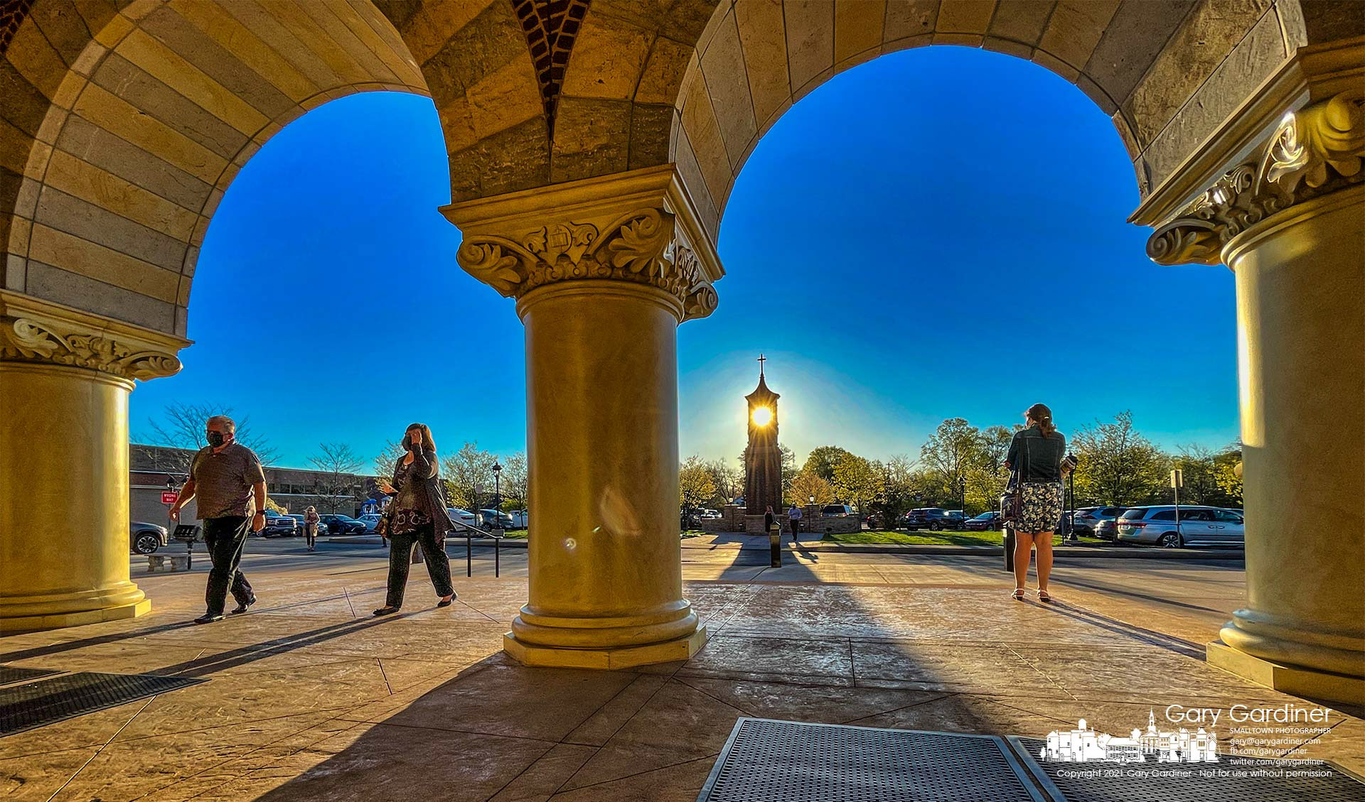 The morning sun shines through the original bell tower as parishioners arrive for Mass at St. Paul the Apostle Catholic church. My Final Photo for April 11, 2021.