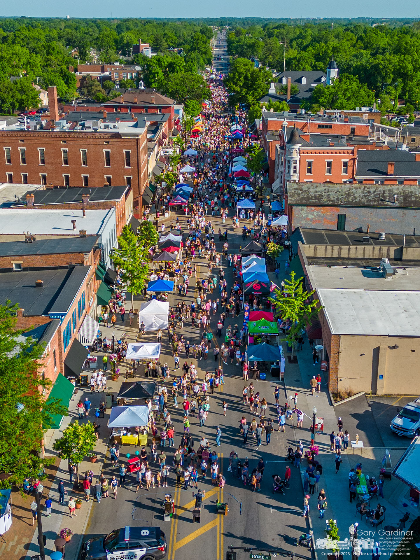 A large crowd, taking advantage of a warm and breezy spring day, fills State Street in Uptown Westerville for the first Fourth Friday event of the year. My Final Photo for May 26, 2023. 