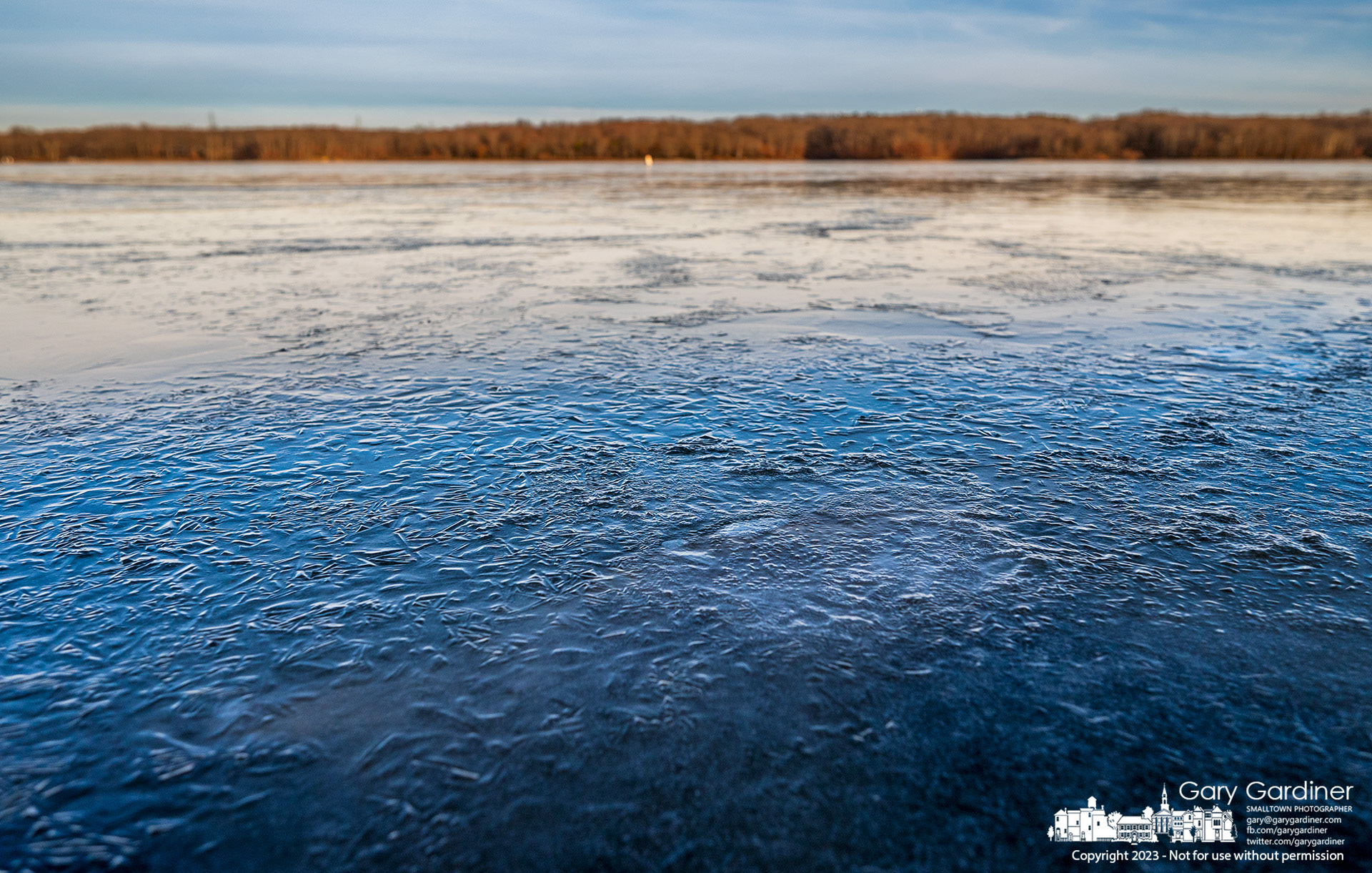 Thickening ice covers the western shoreline of Hoover Reservoir after overnight temperatures fell into the teens. My final Photo for January 15, 2023.