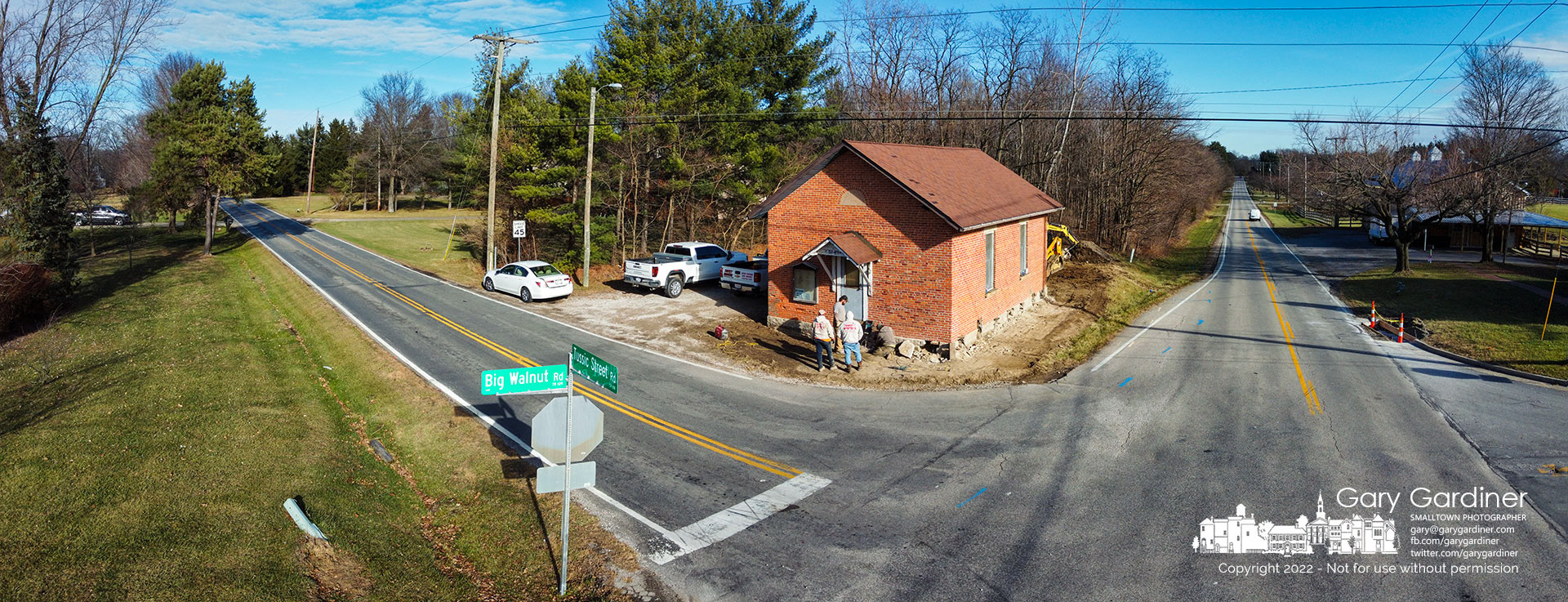 A house moving crew begins work on getting the Genoa township Town House ready to be relocated to nearby McNamara Park to create a clear view of traffic at the difficult Tussic Road and Bog Walnut intersection. My Final Photo for December 5, 2022.