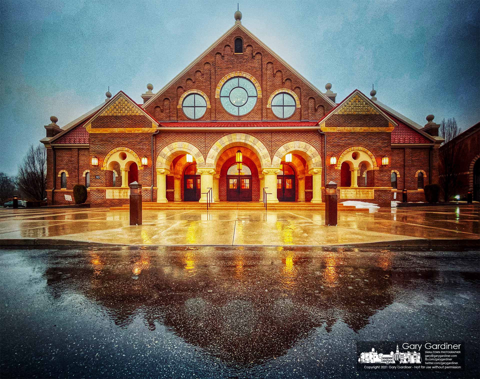 St. Paul the Apostle Catholic Church is reflected in the entrance to the church after an overnight rainstorm. My Final Photo for Feb. 28, 2021.