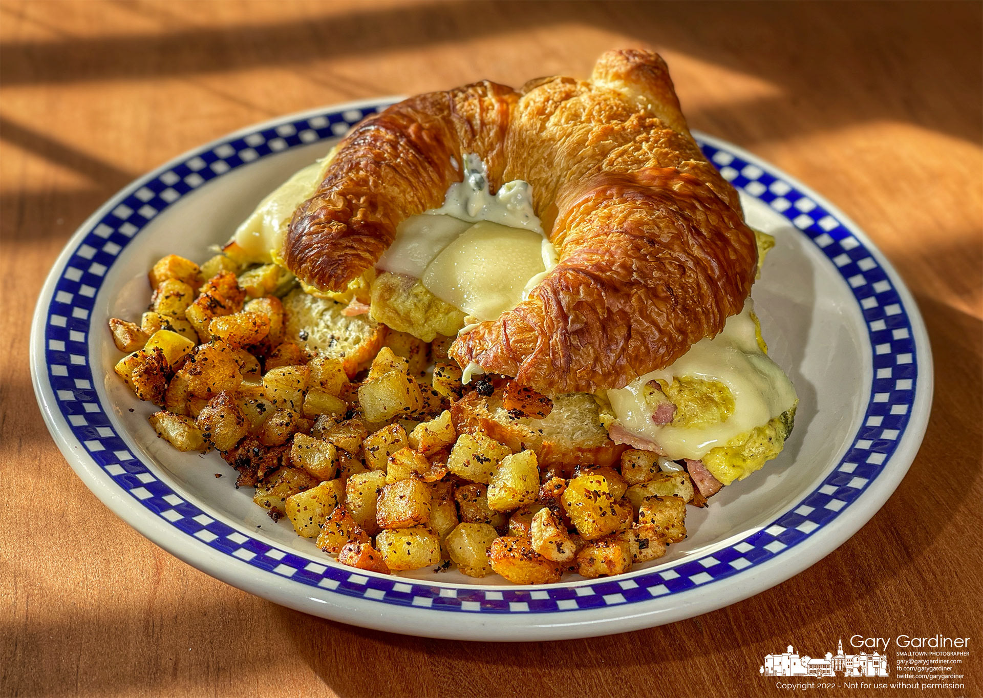 Today's Blue Plate Special was a two-egg omelet with cheese, ham, and jalapenos on a croissant with garlic-cilantro aioli dressing and a side order of home fries. My Final Photo for Jan. 16, 2022.