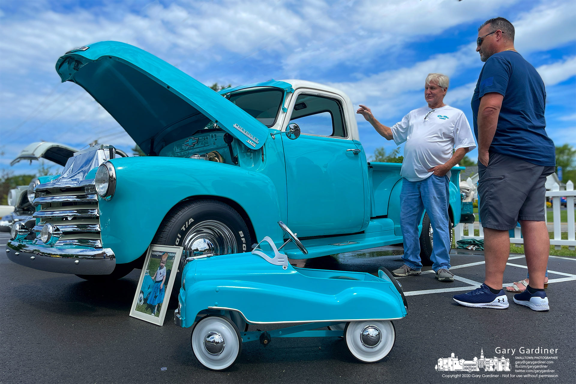 A miniature child’s toy version of a 1953 Chevrolet 3100 step-side pickup truck sits beside a restored original truck at Grace Chapel Community Church. My Final Photo for June 19, 2021.