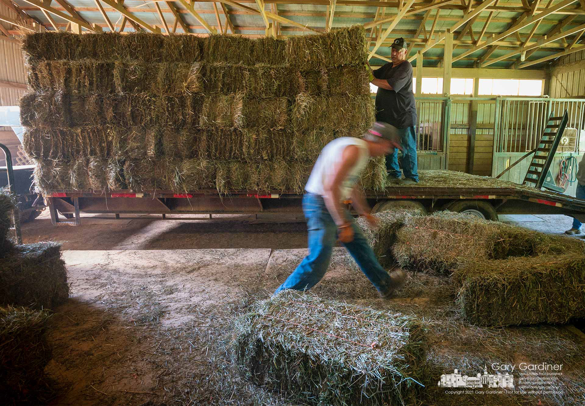 Rodney Parker and Kevin Scott deliver a wagon of hay to a horse barn near Croton, Ohio. My Final Photo for Sept. 2, 2021