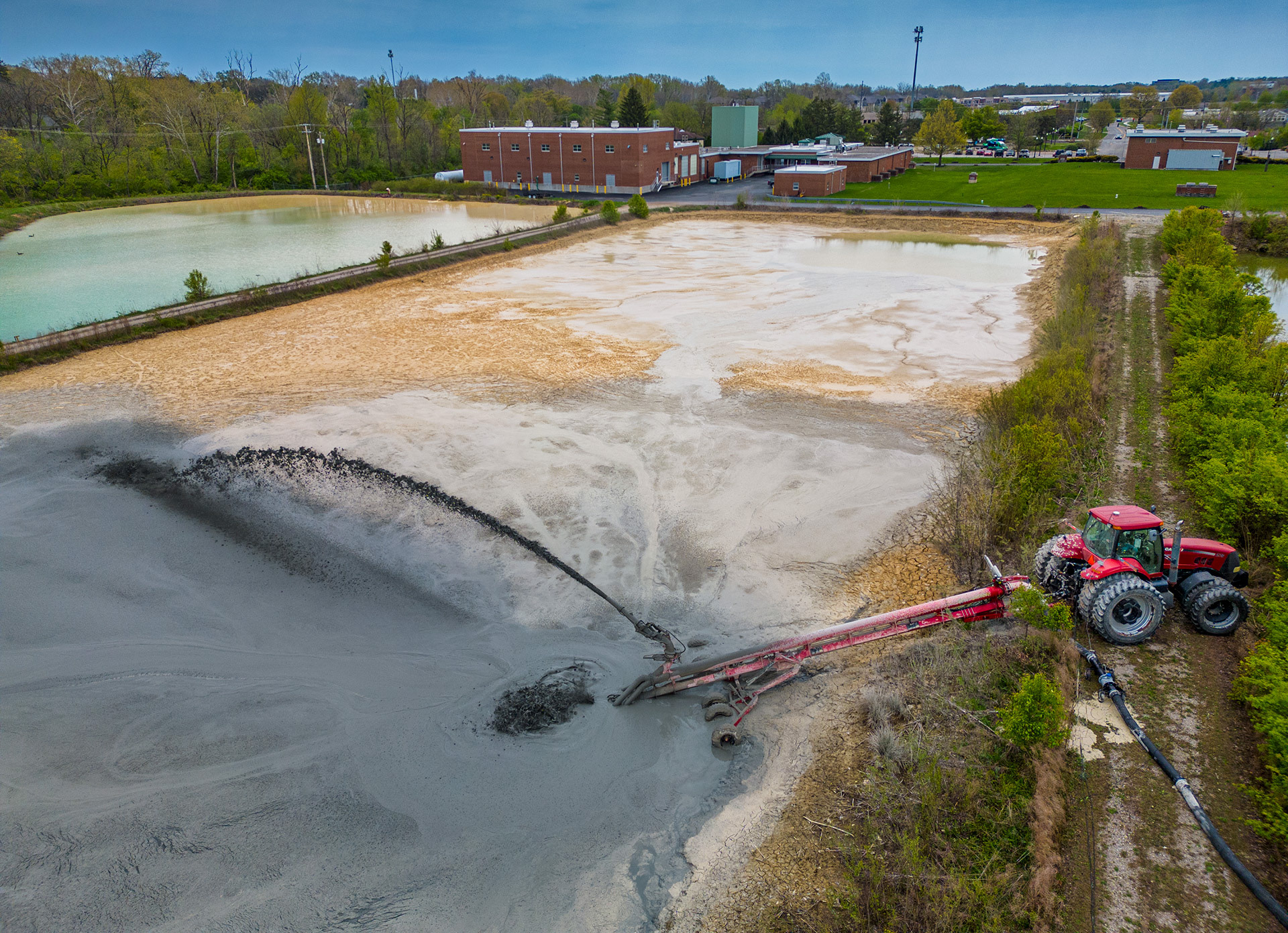 A pumping station sprays sludge to stir the lime holding pond at the city water treatment plant before it is pumped into a tanker truck where it is transported to farms to be spread to aid in the growth of field crops. My Final Photo for April 25, 2023. 