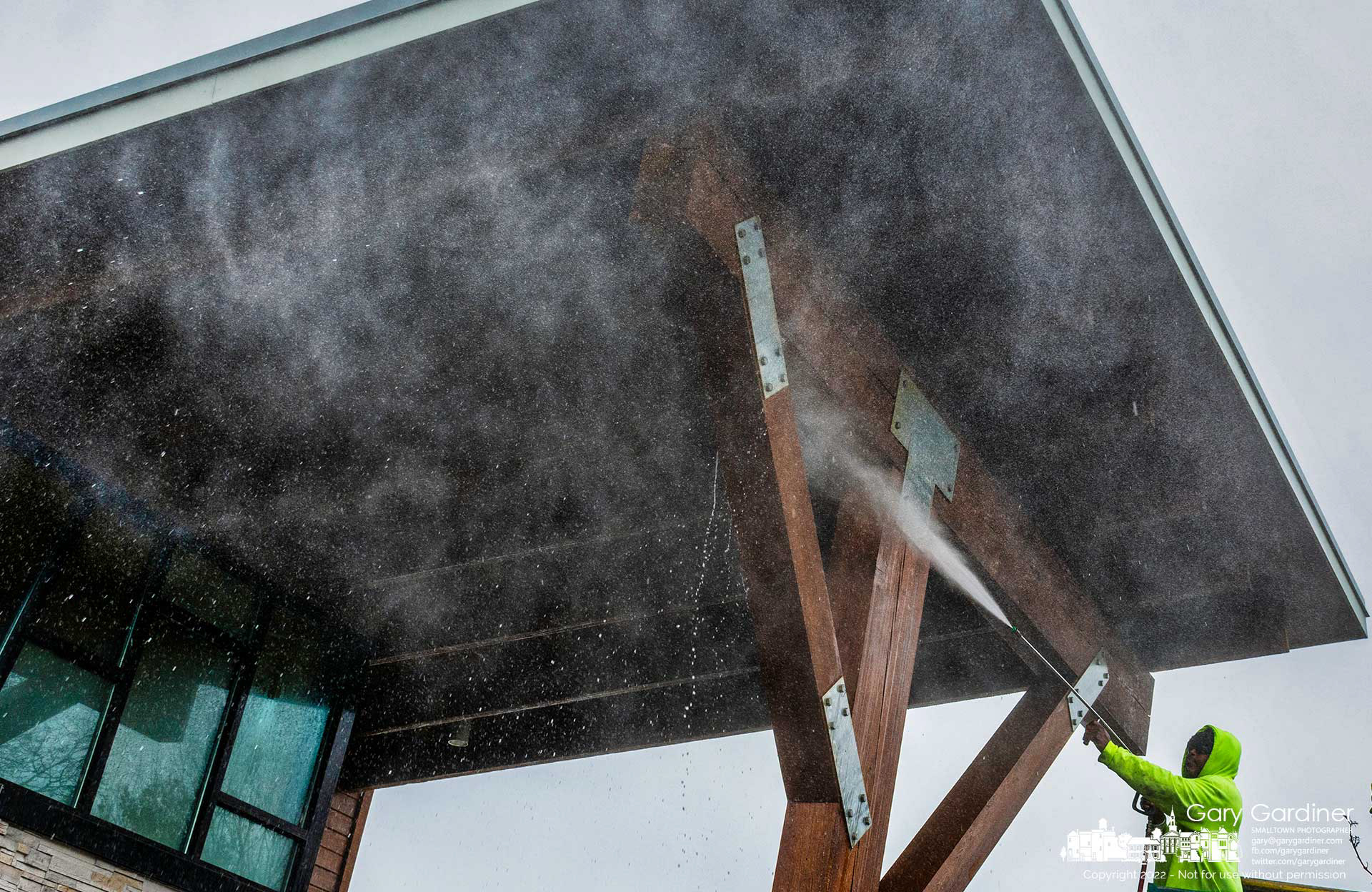 A work crew cleans a section of the woodwork at Highlands Pool preparing the pools, the decks, slides, diving boards, and lounge chairs for opening on the last Saturday of May. My Final Photo for March 22, 2022.
