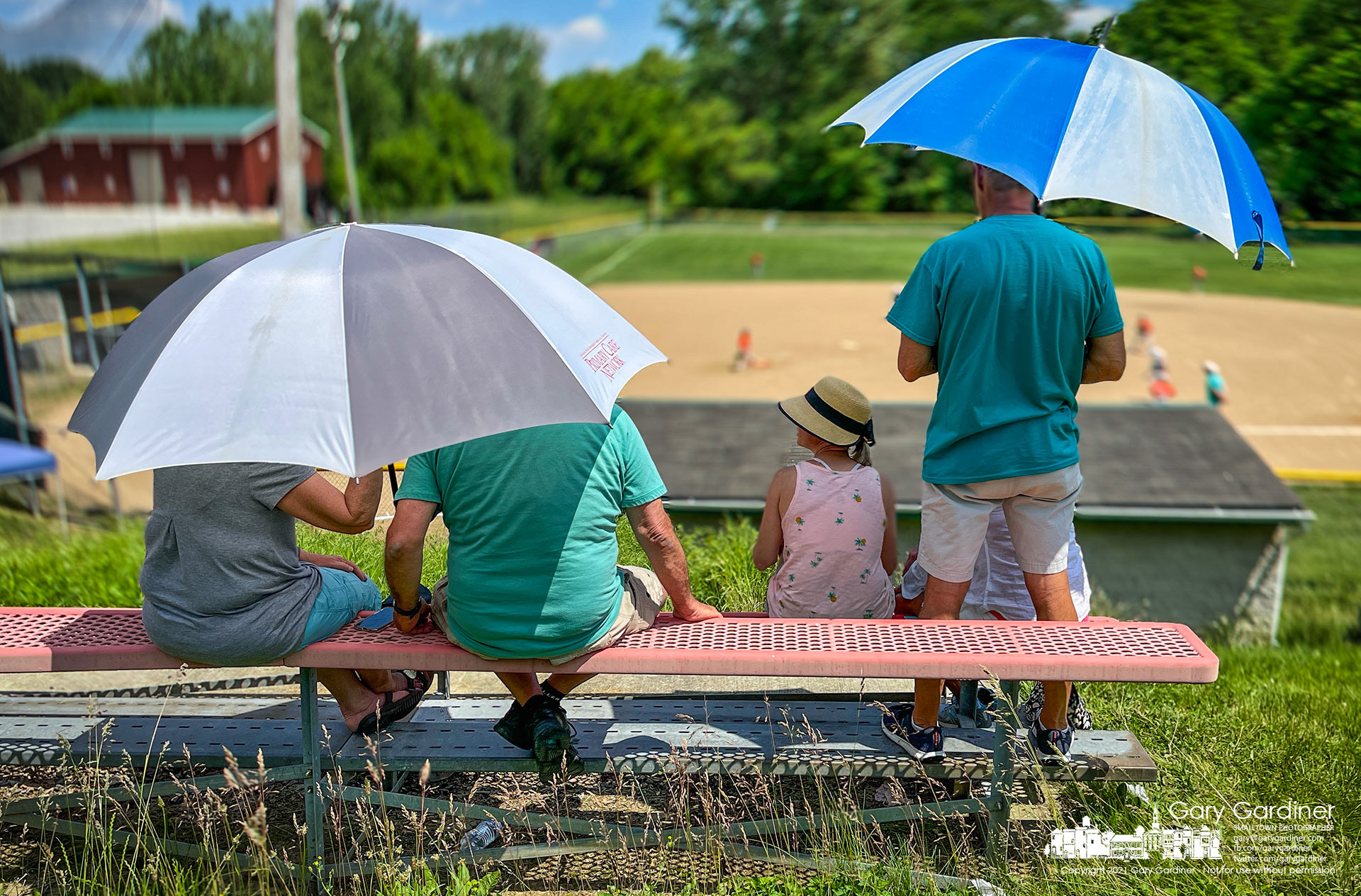 Baseball parents watch their team's game from seats at the upper level of the ballfield in the bottomland along Big Walnut Creek in Galena, Ohio. My Final Photo for June 5, 2021.