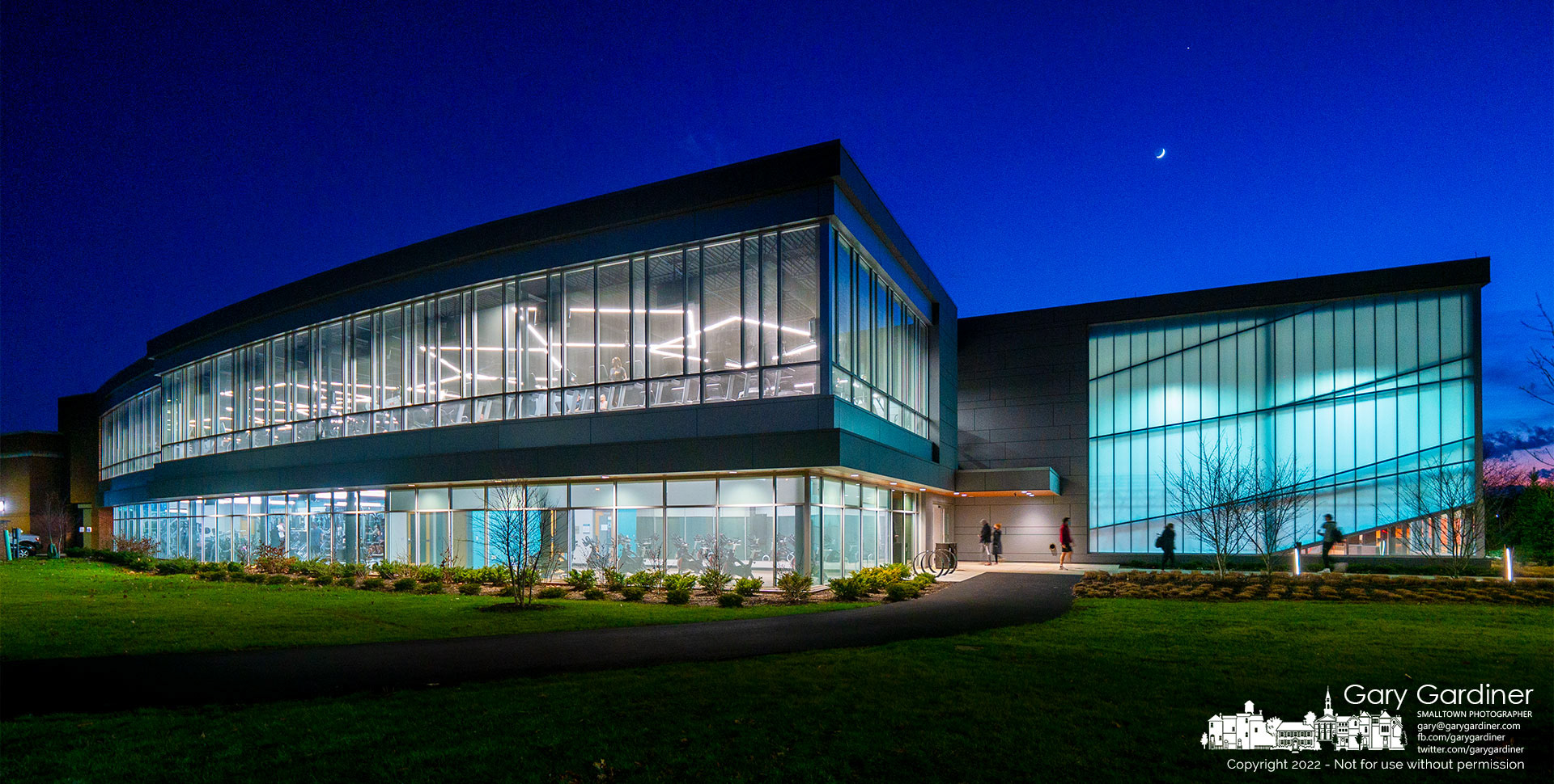 A waxing crescent moon and Jupiter show themselves as a winter sun sets behind the Westerville Community Center. My Final Photo for Jan. 5, 2022