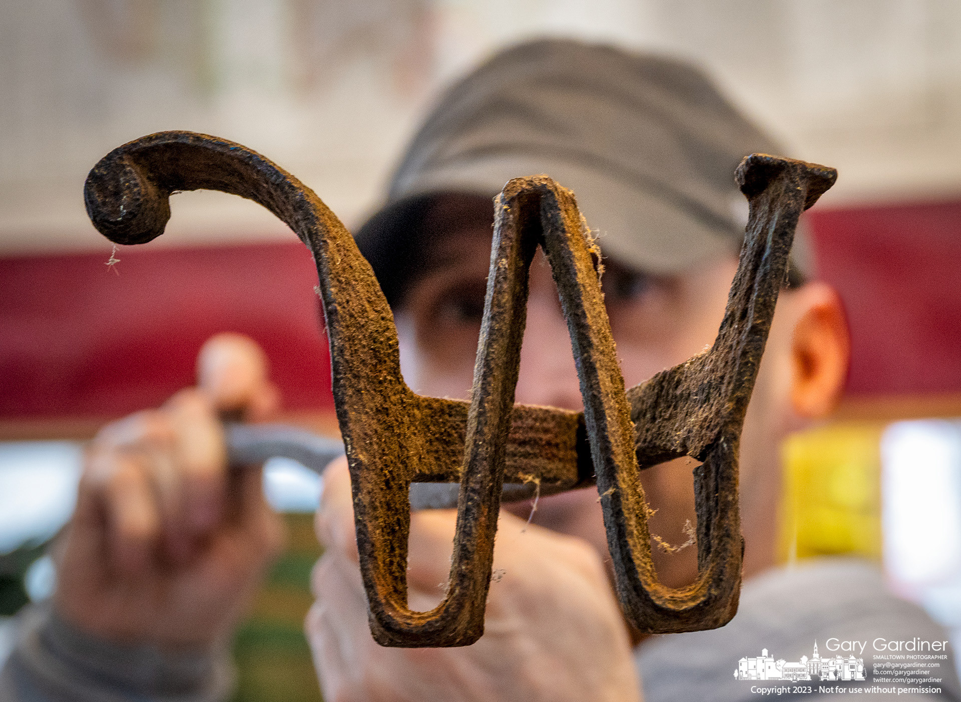 Westerville Antiques owner Luke Ernst holds the "W" branding iron he recently purchased as a rare item once used to brand cattle perhaps on a Westerville cattle farm. My Final Photo for April 6, 2023. 