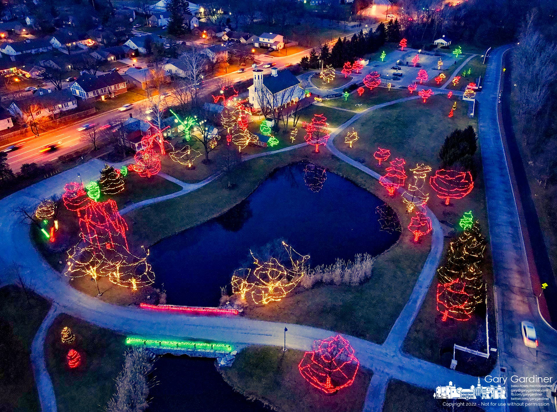 Multi-colored holiday lights brighten the grounds of Heritage Park in Westerville as the city begins to darken a few minutes after sunset Tuesday. My Final Photo for December 13, 2022.
