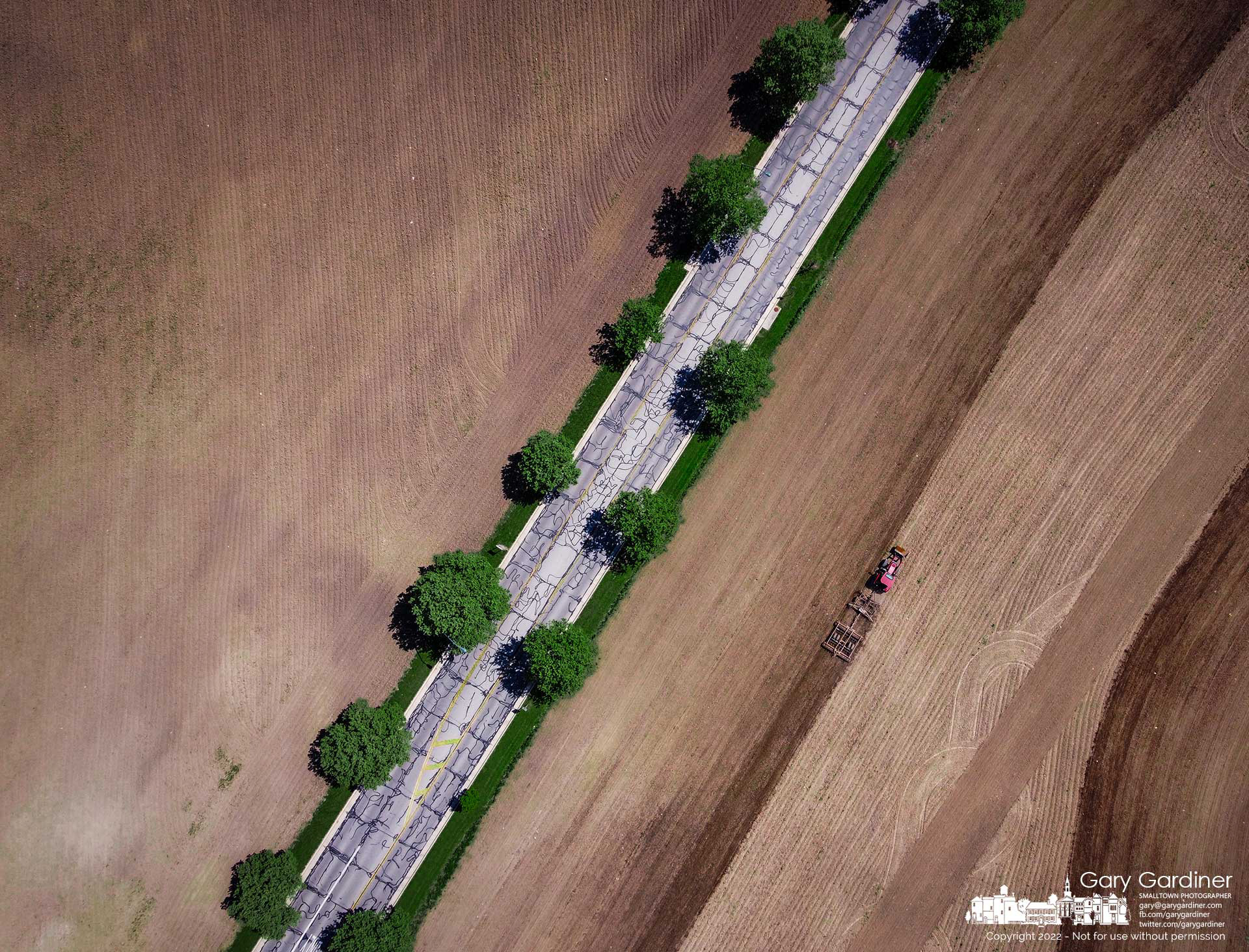 Kevin Scott runs a cultivator over the fields at the Braun Farm for the last time before planting corn and soybeans ahead of the forecast of several days of rain. My Final Photo for May 17, 2022.