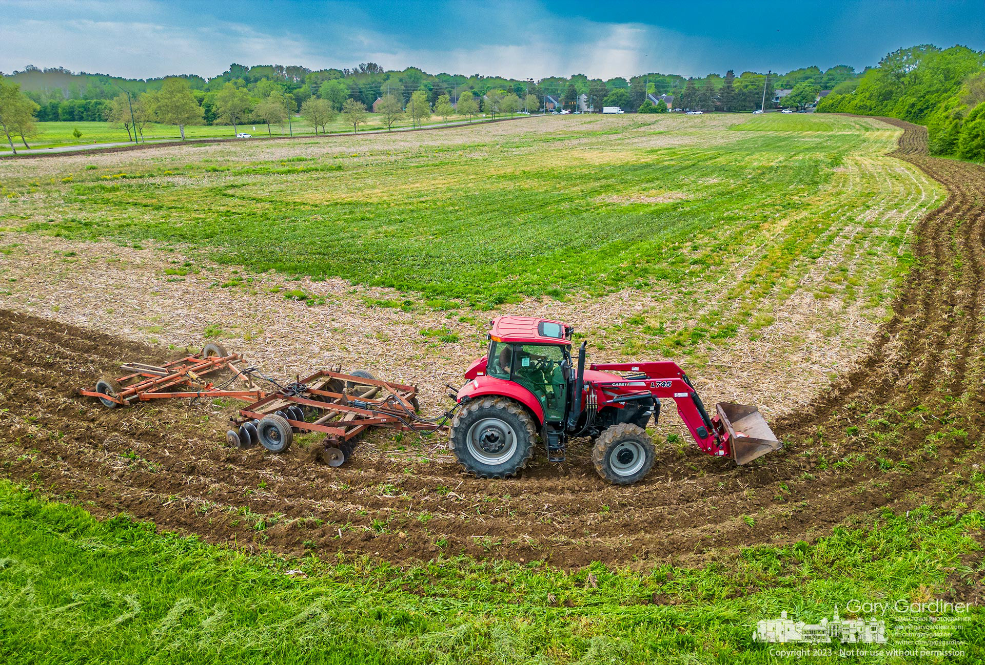 Kevin Scott tills a section of land along Cooper Road, preparing it for planting a new crop. My Final Photo for May 12, 2023. 
