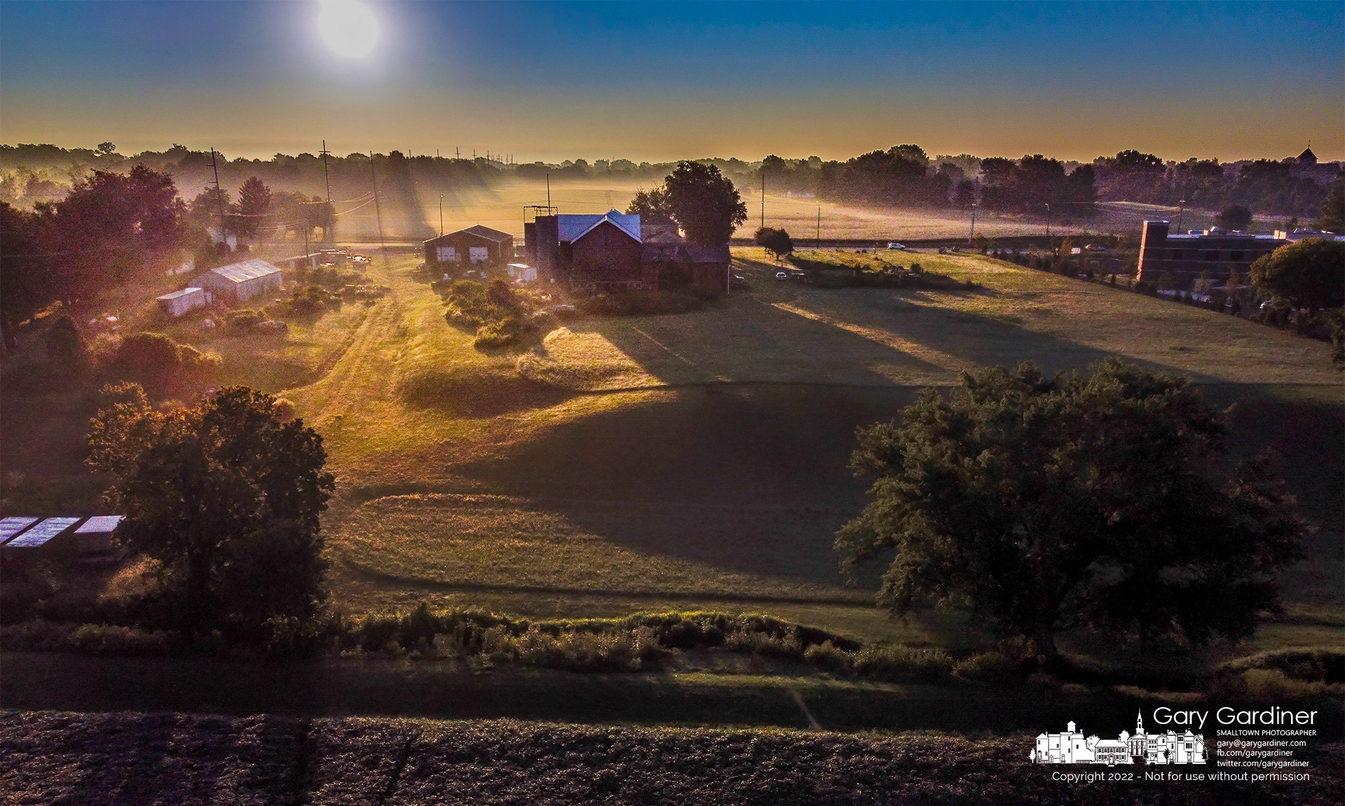 The morning sun casts shadows through the ground fog lying across the fields and buildings at the Yarnell Farm on Africa Road. My Final Photo for August 23, 2022.