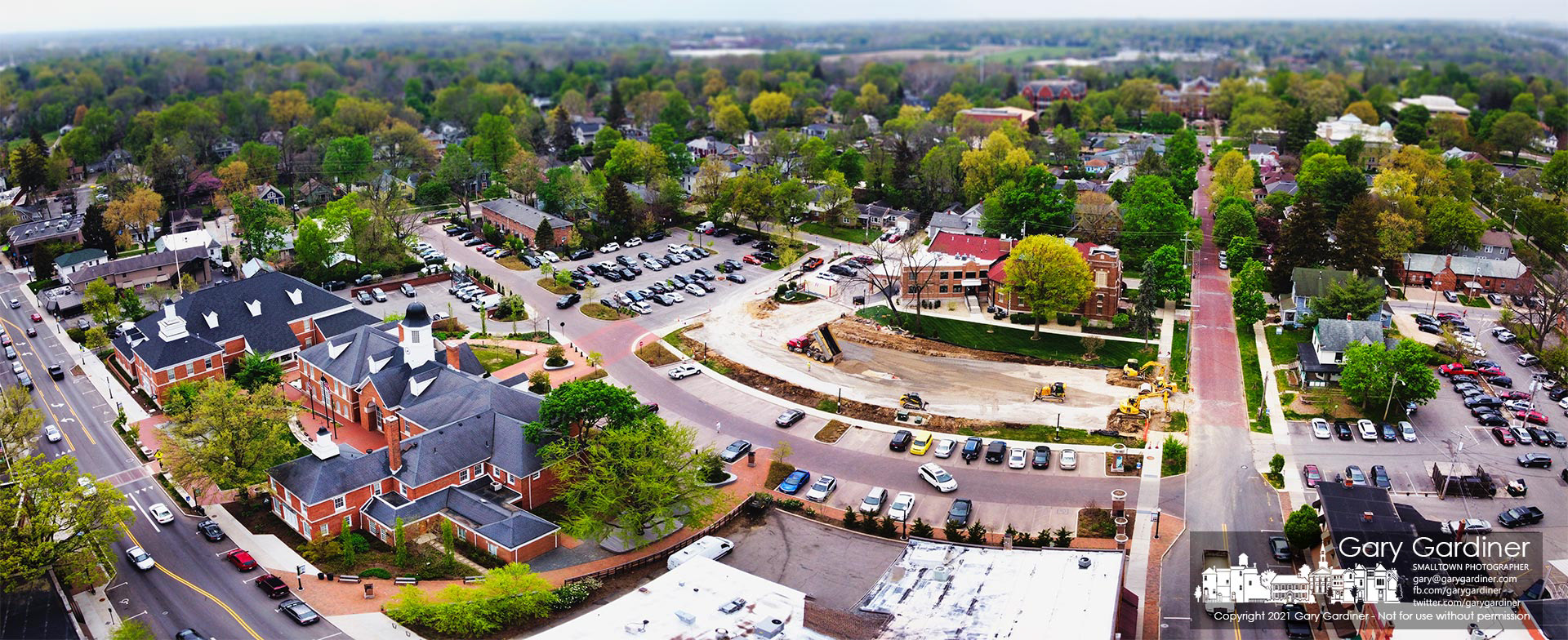 A  GPS-guided bulldozer levels gravel in what will be the new parking lot behind city hall. My Final Photo for April 28, 2021.