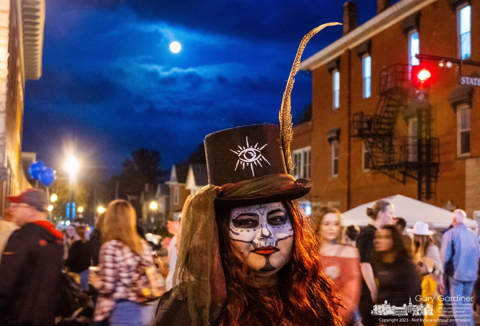 A full moon complemented a night of wizards, witches, demons, vampires, princesses, and unknown spirits at Midnight Madness, the last Fourth Friday of the season in Westerville. My Final Photo for October 27, 2023. https://bit.ly/3tQDBwH