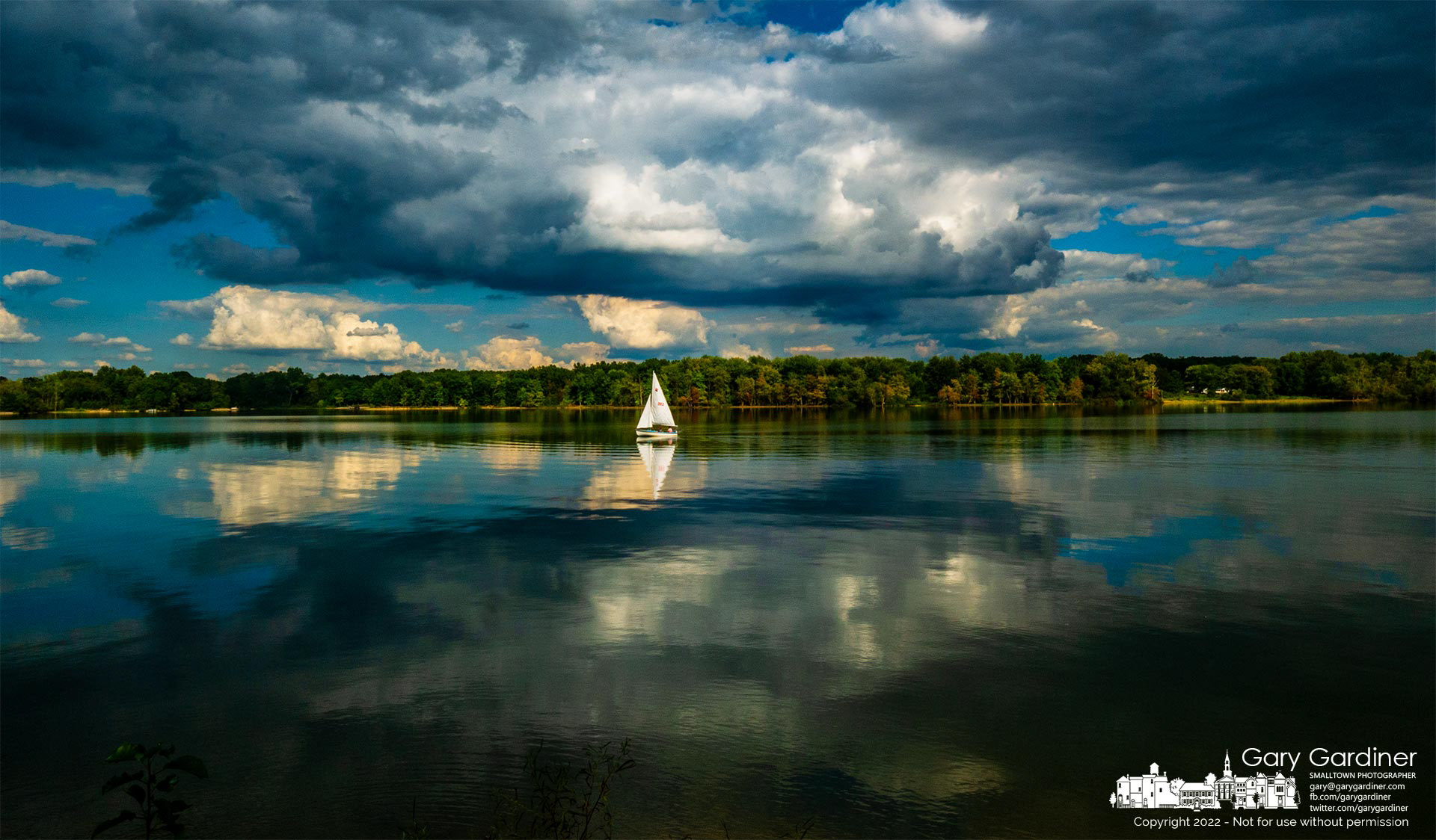 A sailor uses the rudder to move his sailboat through the waters of Hoover Reservoir as he returns to the Red Bank boat ramp. My Final Photo for September 1, 2022.