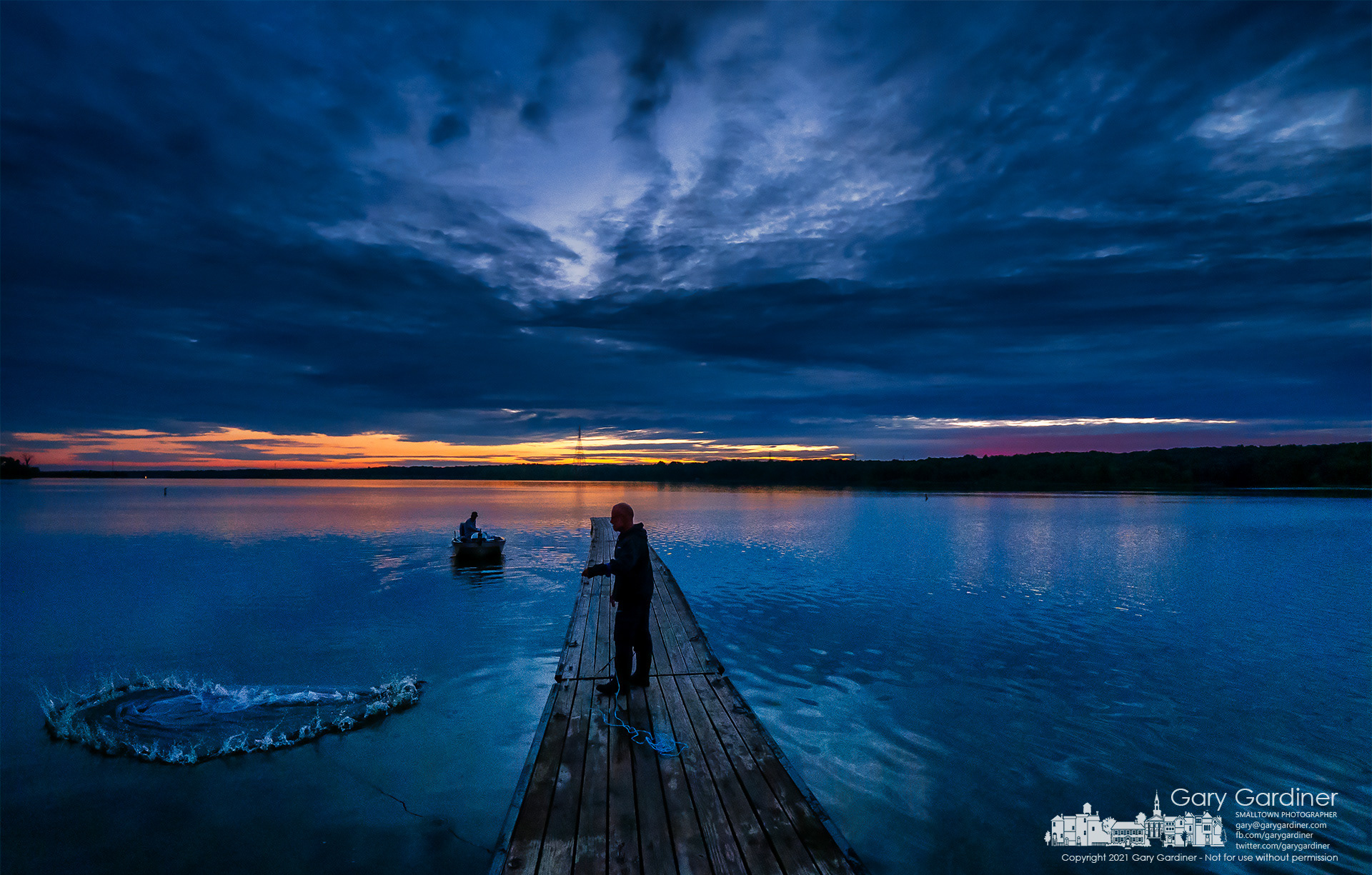 A fisherman casts for baitfish just before sunrise where he and his fishing companions prepared to launch a day of fishing dreams on Hoover Reservoir. My Final Photo for Sept. 4, 2021.