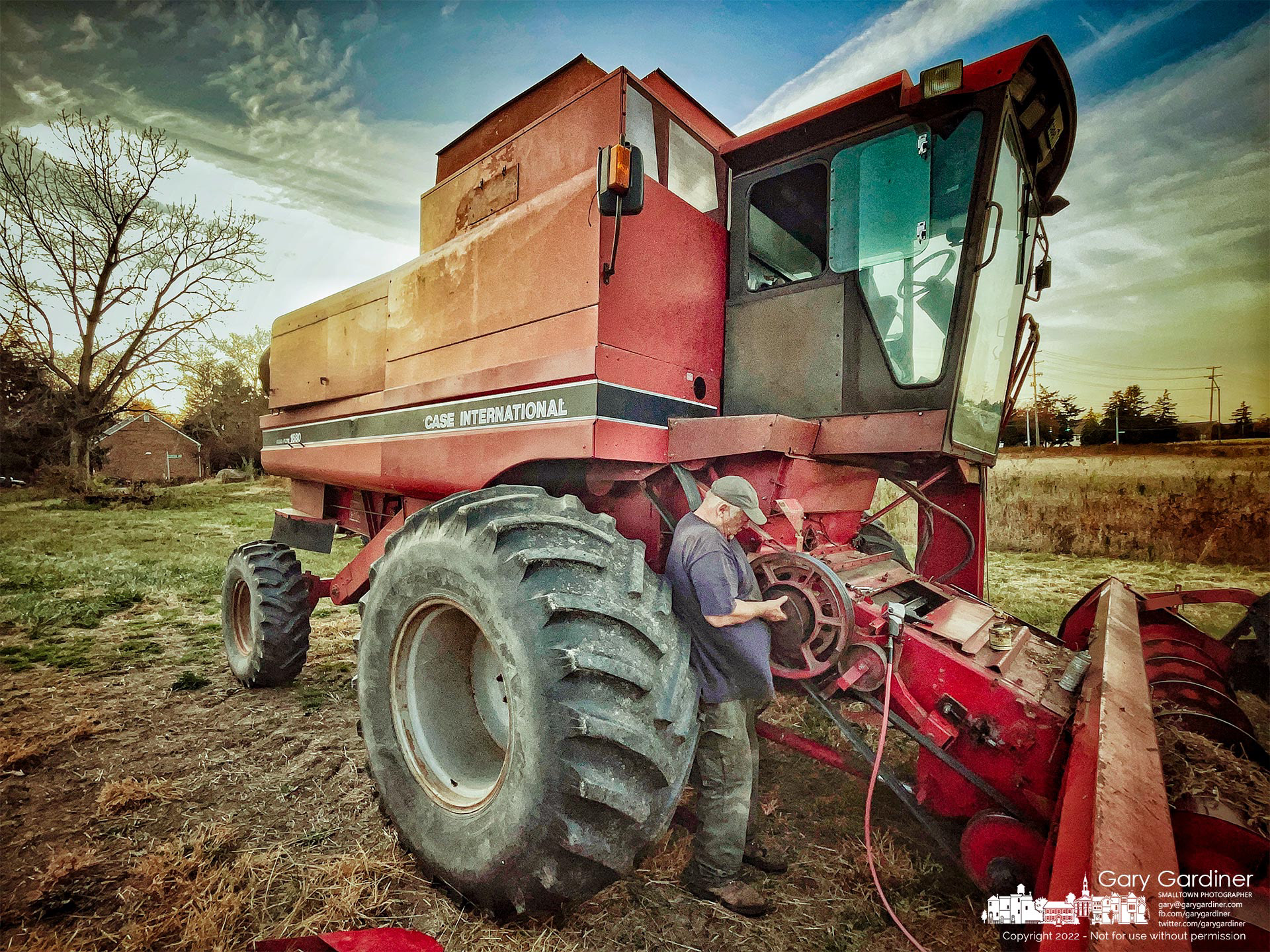 Farmer Kevin Scott makes repairs after sunset to a pulley system on his combine after it failed as he began harvesting the soybean crop at the Braun Farm property on Cleveland Ave. At Cooper Road. My Final Photo for November 4, 2022.
