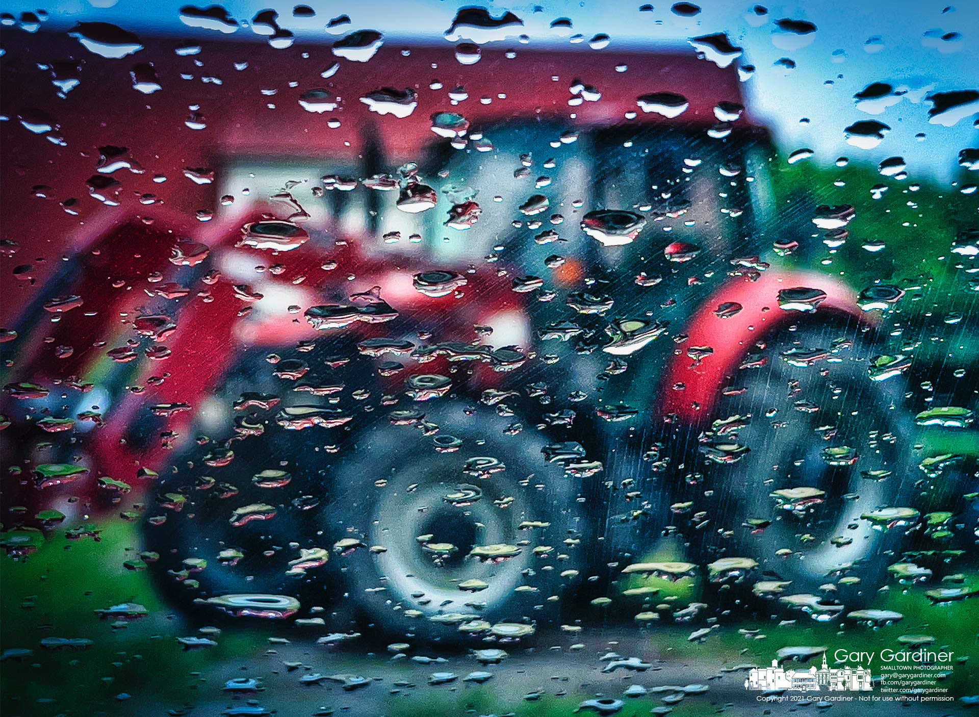 Raindrops on a car windshield mark the difficulty for plans to plow and replant the fields at the Braun Farm on a very wet Monday. My Final Photo for June 7, 2021.
