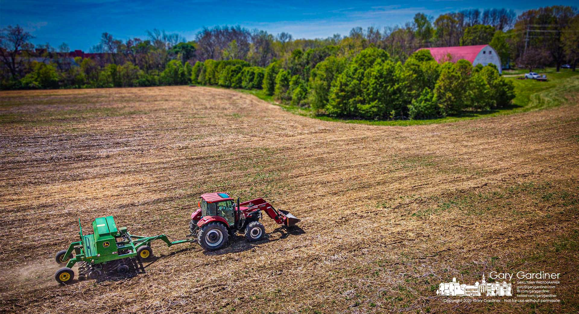 Kevin Scott runs a soybean planter over the fields at the Braun Farm hoping to finish this field and several others before rain starts tomorrow night. My Final Photo for April 27, 2021. 