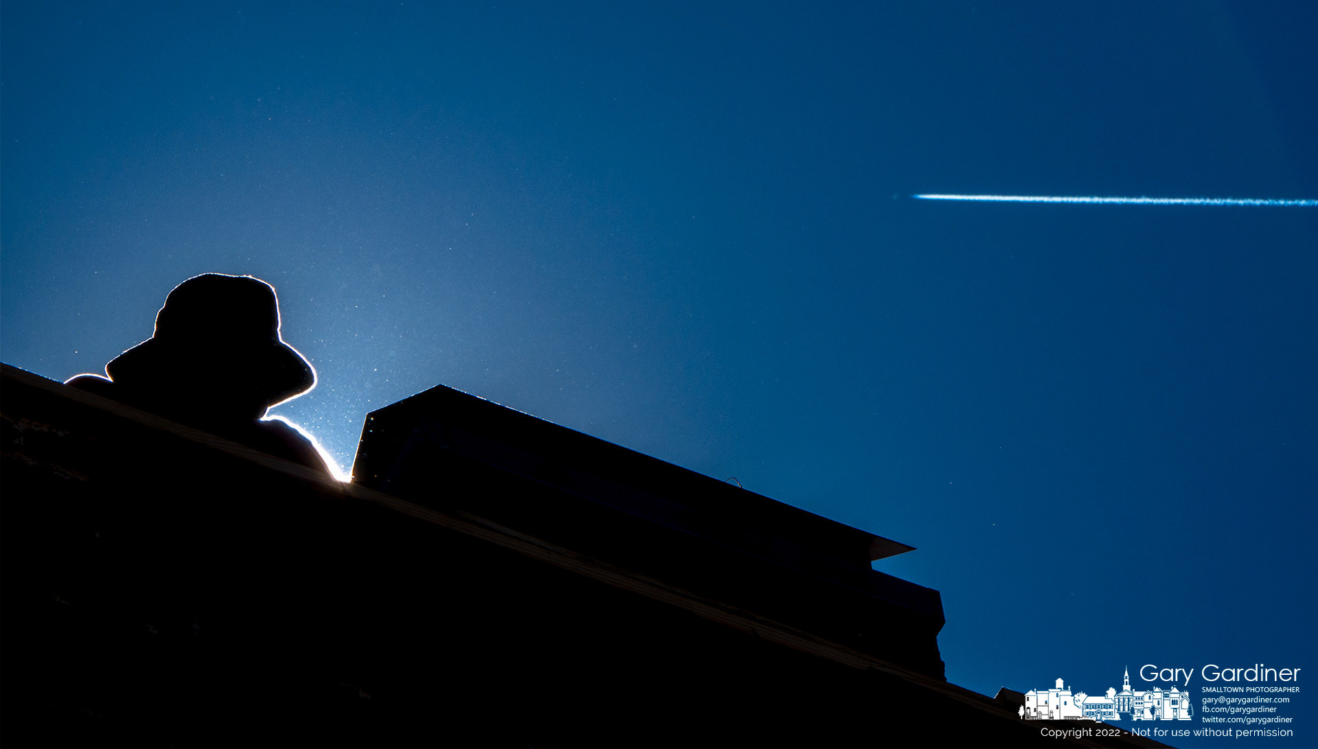 A roofer is silhouetted against the afternoon sun as he installs flashing along the edge of the new roof at the Old Bag o' Nails building at State and Main in Uptown Westerville. My Final Photo for Sept. 9, 2022.