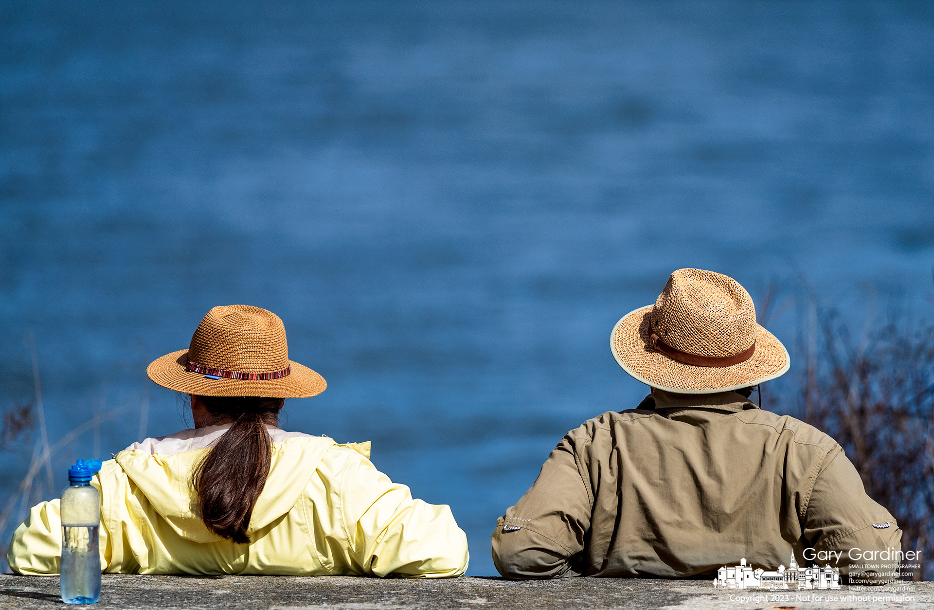 A couple relaxes at Red Bank Park looking over Hoover Reservoir where big Walnut Creek became Hoover Reservoir after a dam was built further downstream in the 50s. My Final Photo for February 23, 2023.