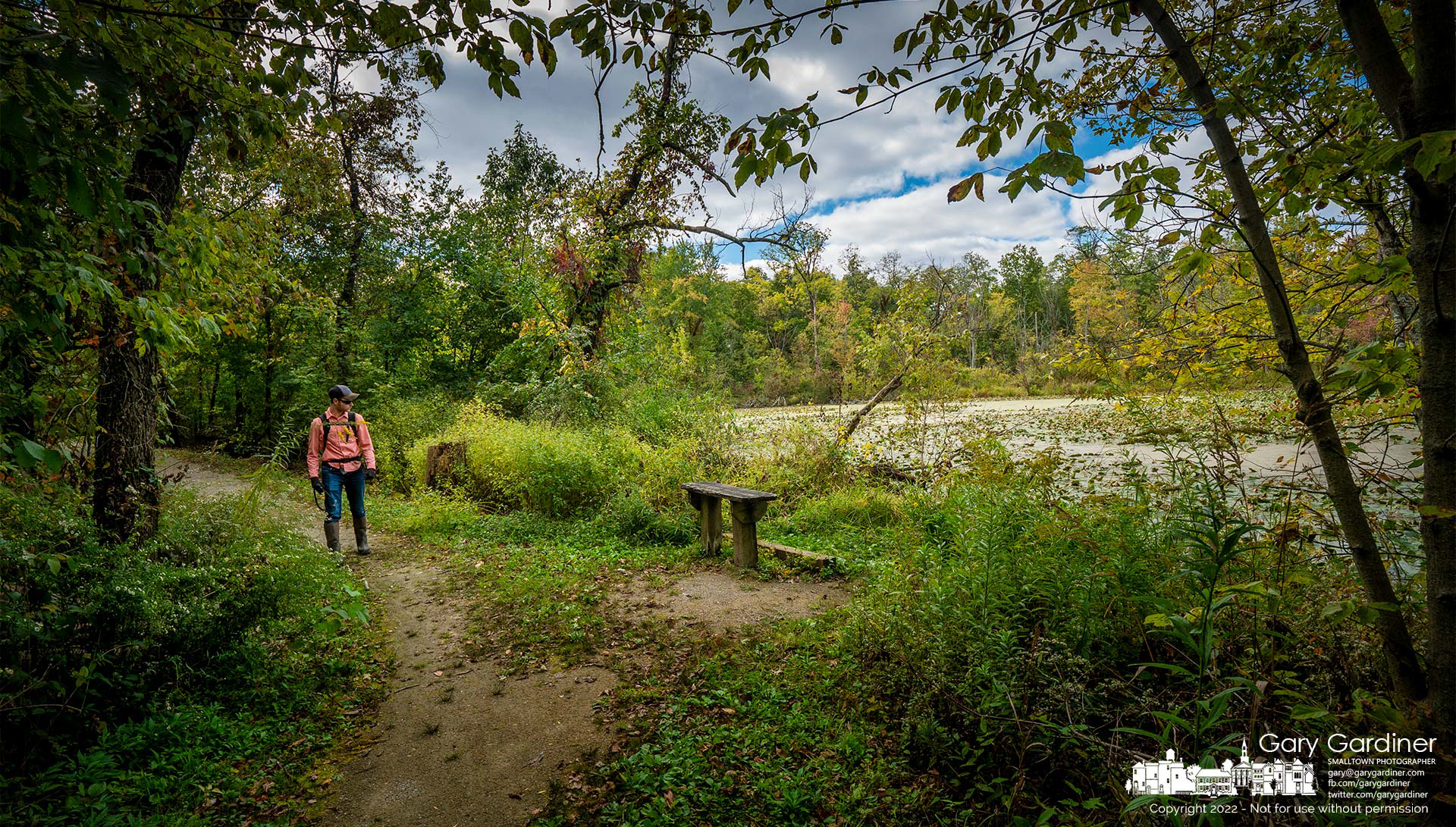 An environmental technician searches for invasive plants in Boyer Nature Preserve before treating them with an herbicide as part of a program to keep city parks free of invasives such as honeysuckle, Bradford pears, winter creeper, and multi-flora rose. My Final Photo for September 29, 2022.