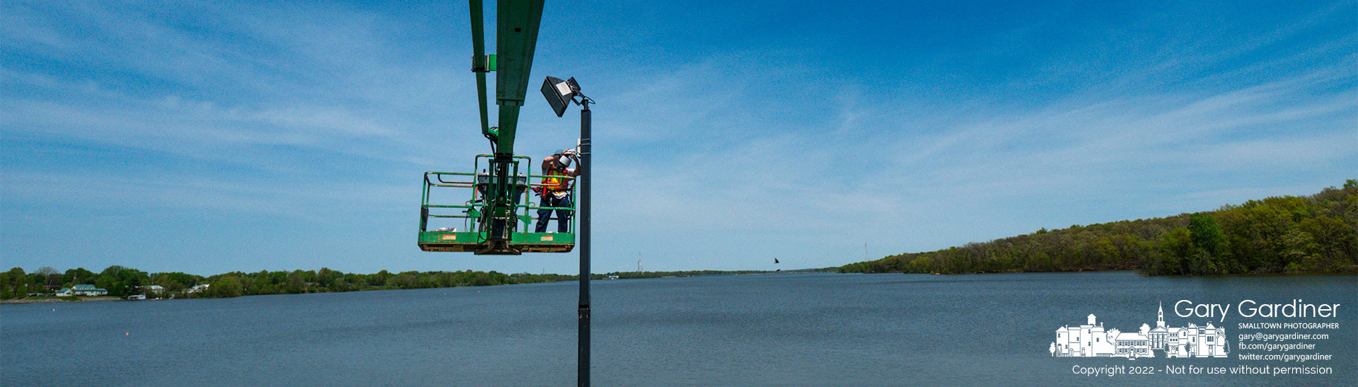 An electrician replaces a security camera overlooking a section of Hoover Dam as the structure receives updates replacing some equipment as old as the dam which was opened in 1955 to supply water for Columbus. My Final Photo for May 10, 2022