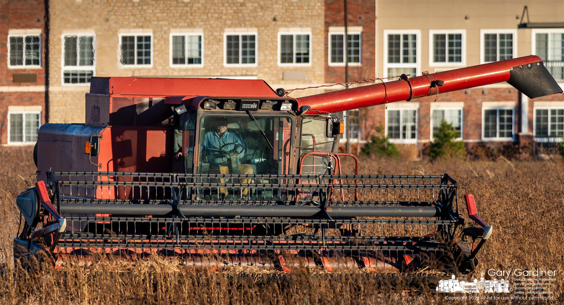 Kevin Scott returns to the barn with his combine to clear a feed chute that jammed with soybeans and weeds that were still growing under streetlights along Cooper Road. My Final Photo for November 6, 2022.