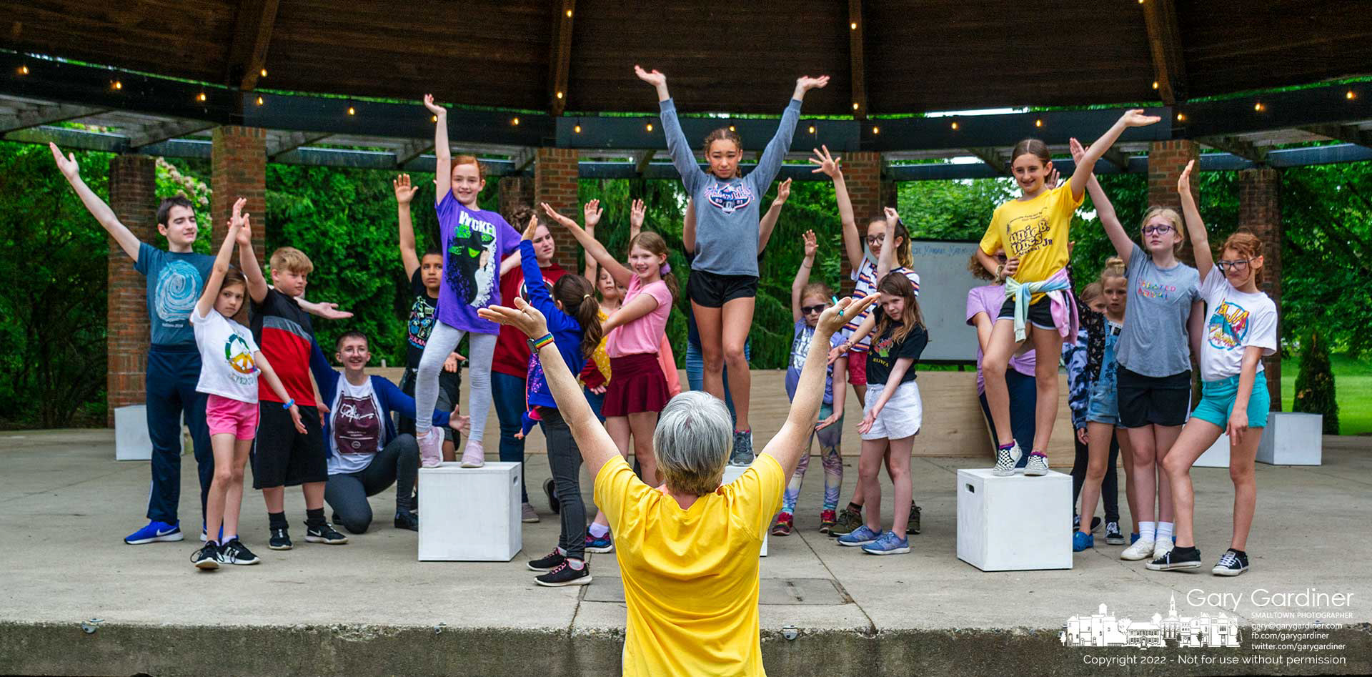 The cast of Junie B. Jones The Musical Jr. receives instructions on the proper flourish at the completion of one of the songs in the Civic Youth Theater production of the musical June 2-5, 2022. My Final Photo for May 22, 2022.