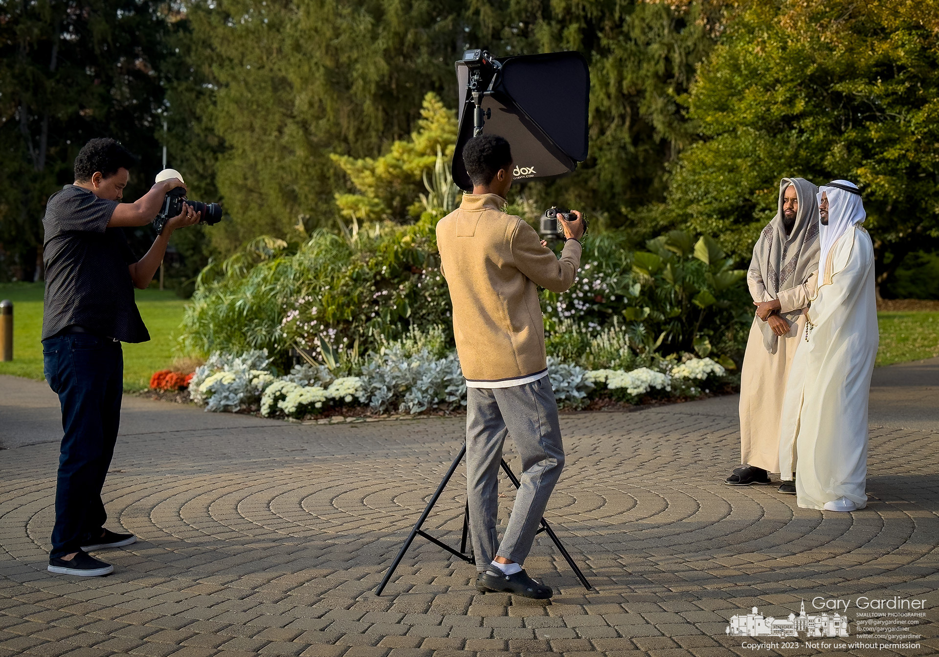 Portrait subjects briefly pose together at the entrance to Inniswood Metro Gardens on a day when every possible photo background was in use. My Final Photo for October 26, 2023. https://bit.ly/3Fx4ZCn 