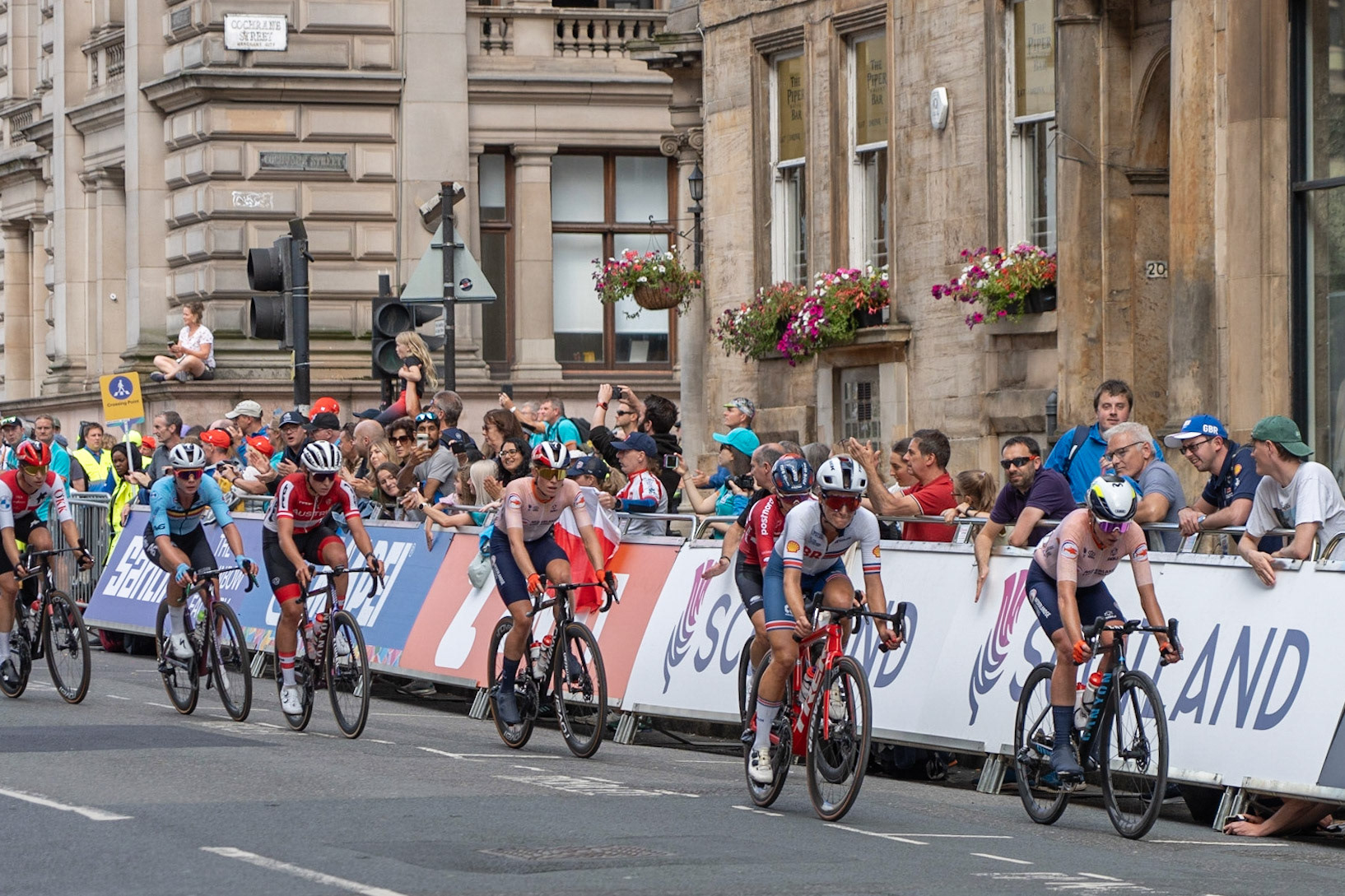 Glasgow, Scotland, UK. 13th August 2023. UCI World Championships – Lotte Kopecky of Belgium wins the Women’s Elite Road Race Road Race from Loch Lomond to Glasgow ending with 6 laps of the city centre circuit. Credit R.Gass/Alamy Live News