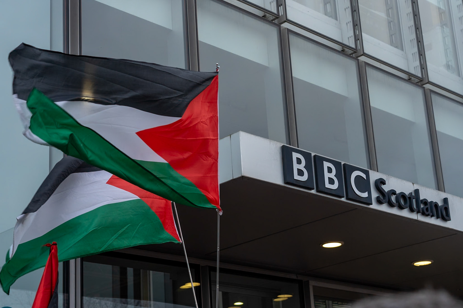 Glasgow, Scotland, UK. 20th January, 2024. Pro Palestine rally and protest outside BBC Scotland Headquarters in Glasgow involving a re-enactment of the killing of children and journalists in Gaza. Credit: R.Gass/Alamy Live News