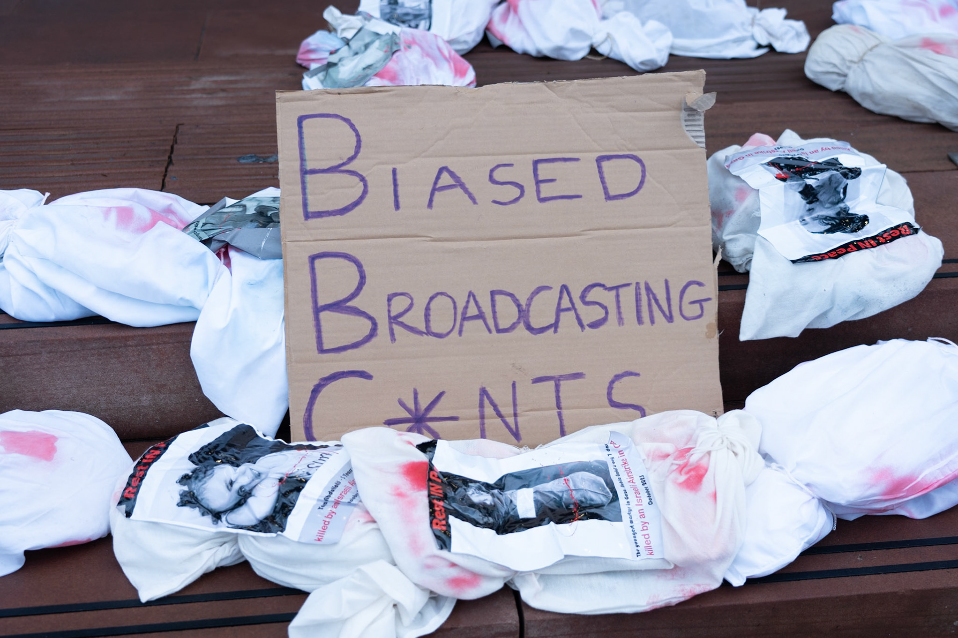 Glasgow, Scotland, UK. 20th January, 2024. Pro Palestine rally and protest outside BBC Scotland Headquarters in Glasgow involving a re-enactment of the killing of children and journalists in Gaza. Credit: R.Gass/Alamy Live News
