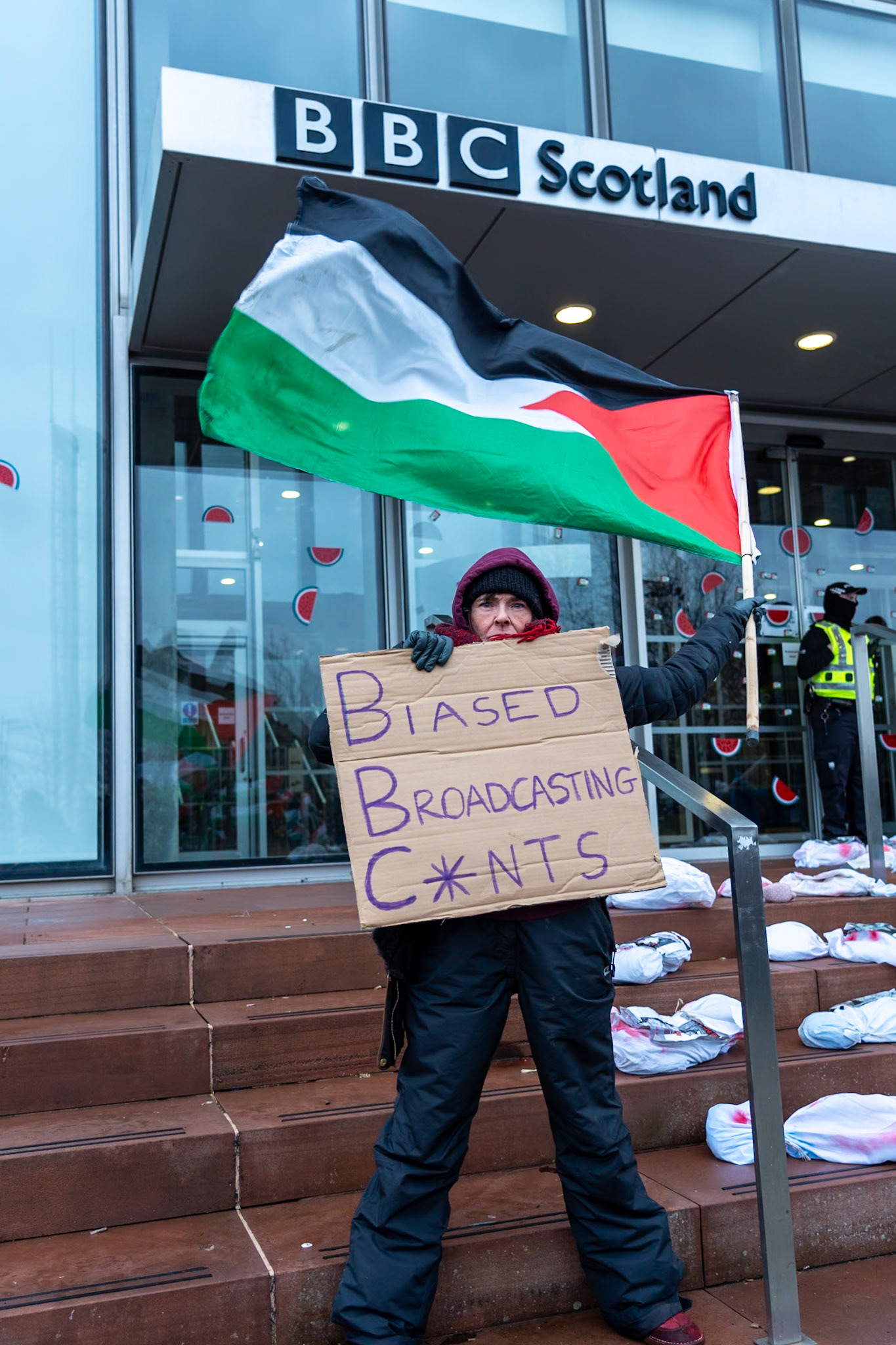 Glasgow, Scotland, UK. 20th January, 2024. Pro Palestine rally and protest outside BBC Scotland Headquarters in Glasgow involving a re-enactment of the killing of children and journalists in Gaza. Credit: R.Gass/Alamy Live News