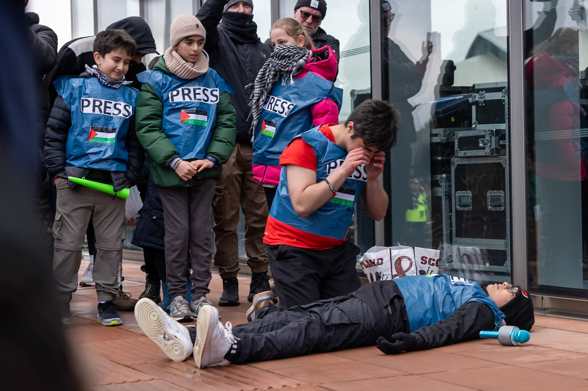 Glasgow, Scotland, UK. 20th January, 2024. Pro Palestine rally and protest outside BBC Scotland Headquarters in Glasgow involving a re-enactment of the killing of children and journalists in Gaza. Credit: R.Gass/Alamy Live News