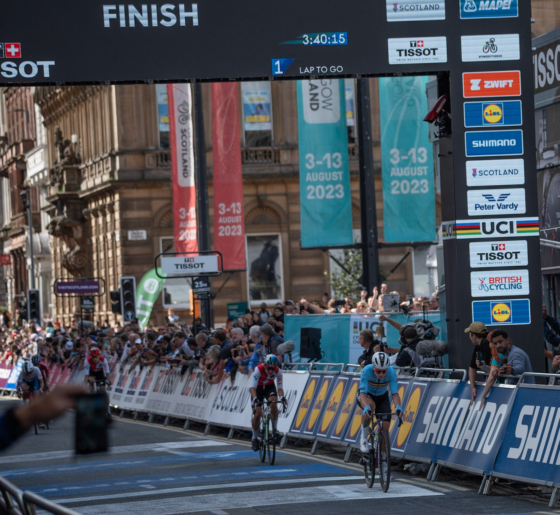 Glasgow, Scotland, UK. 13th August 2023. UCI World Championships – Lotte Kopecky of Belgium wins the Women’s Elite Road Race Road Race from Loch Lomond to Glasgow ending with 6 laps of the city centre circuit. Credit R.Gass/Alamy Live News